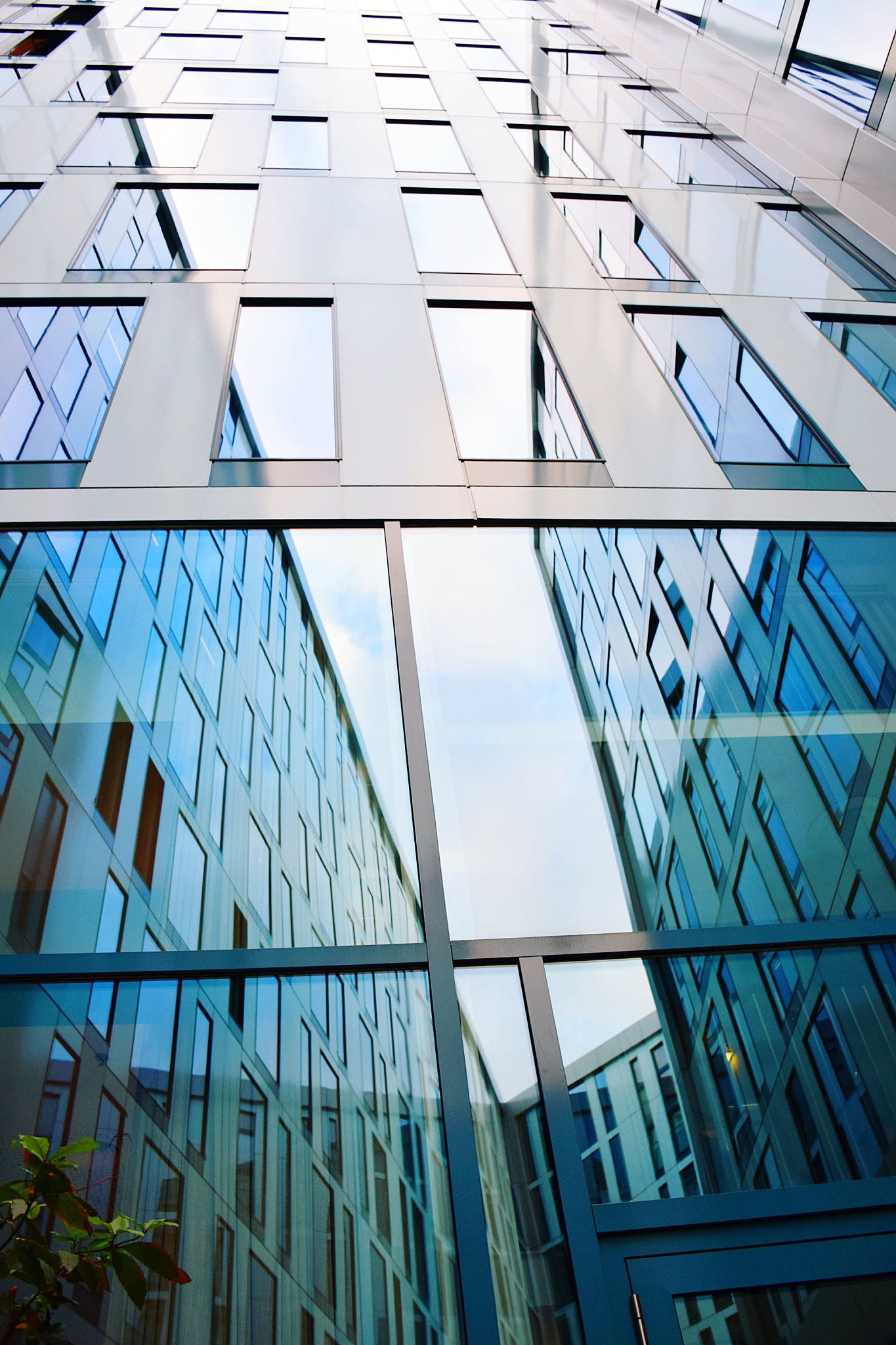 low angle view of glass building against sky