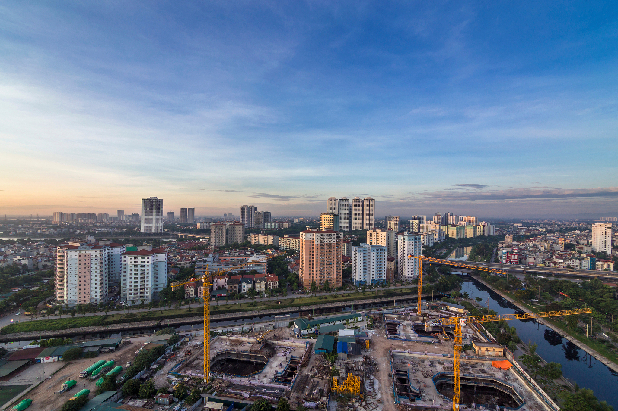 high angle view of road amidst buildings in city against sky