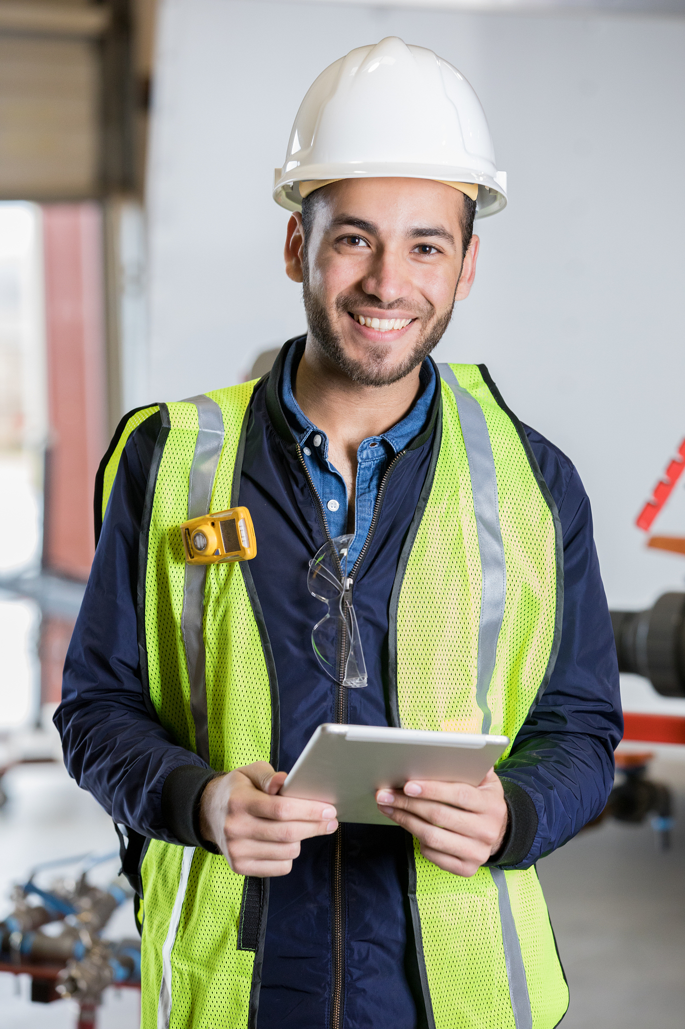 engineer in oil and gas industry is using a digital tablet and s