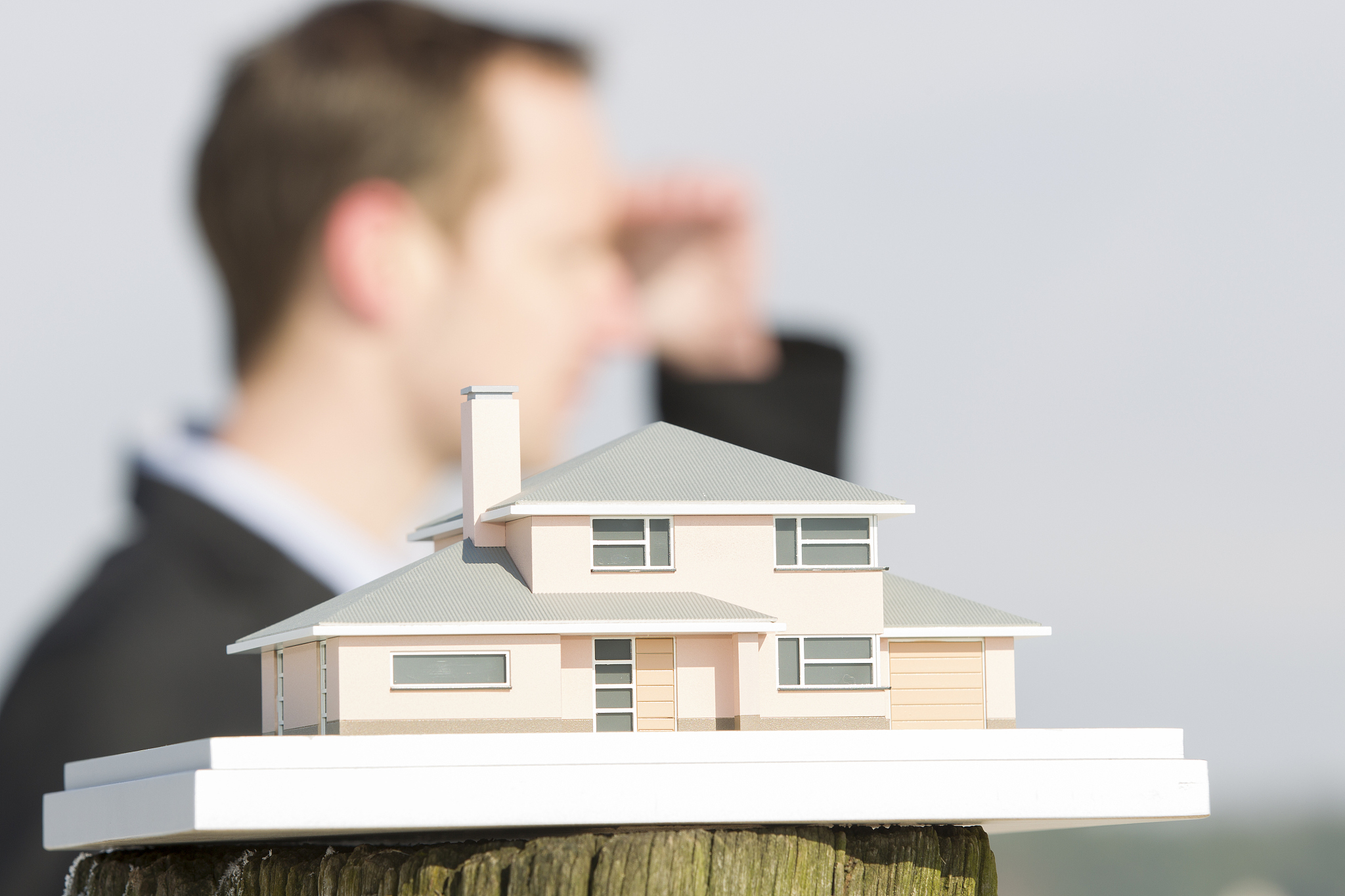 model house, real estate agent searching for building land