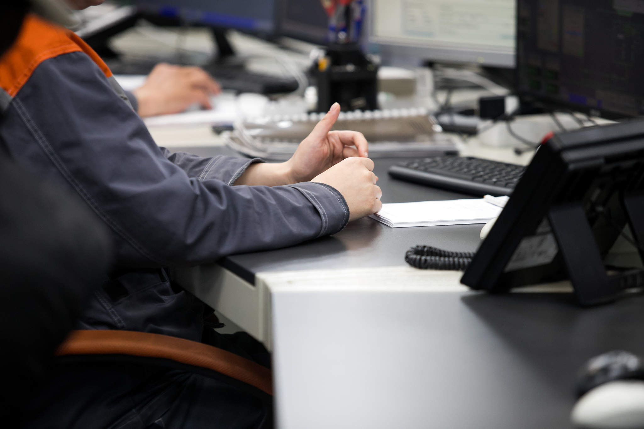 engineering works with the tablet in the production control room