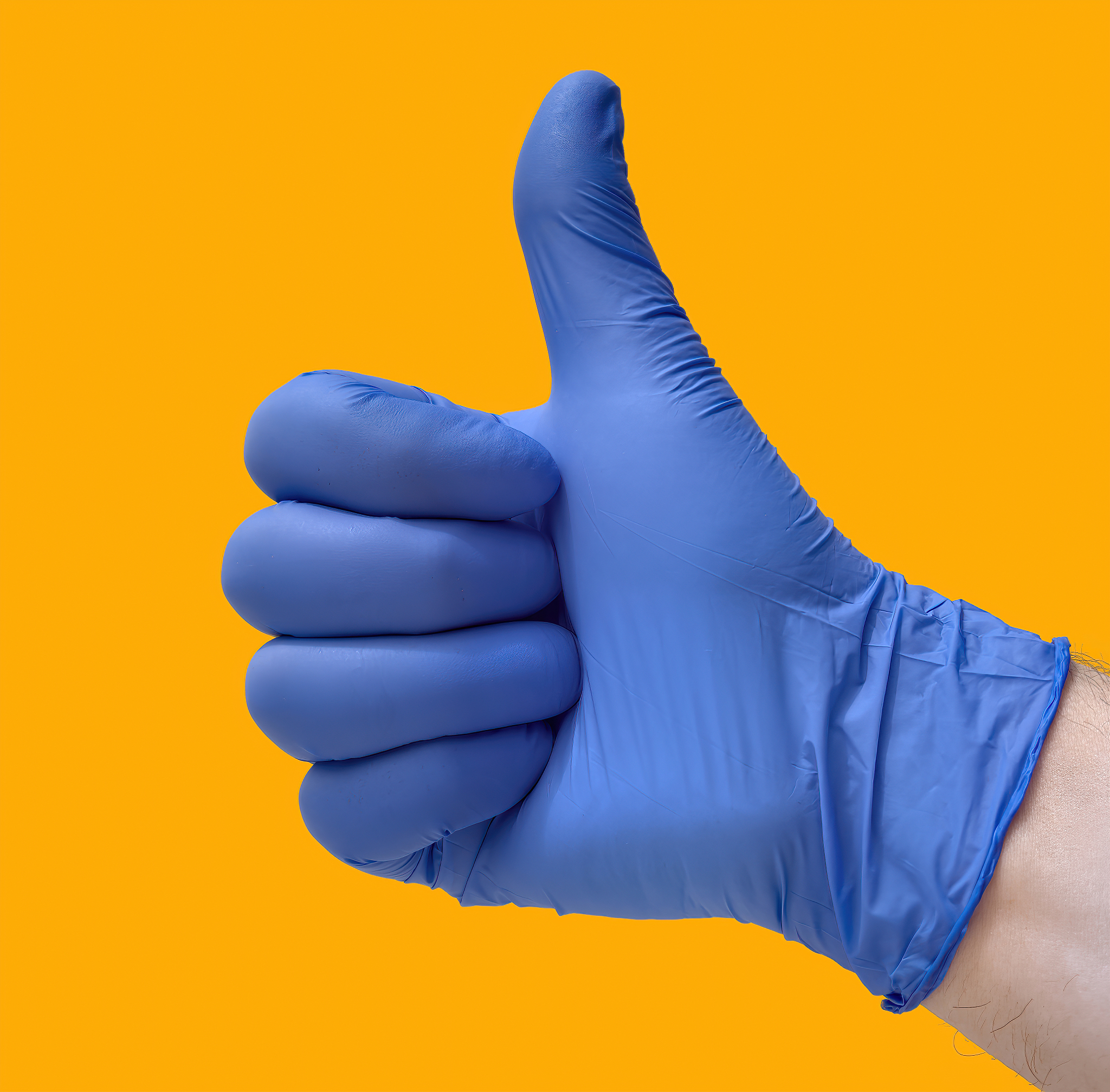 hand with thumb up, with blue glove and yellow background. conce