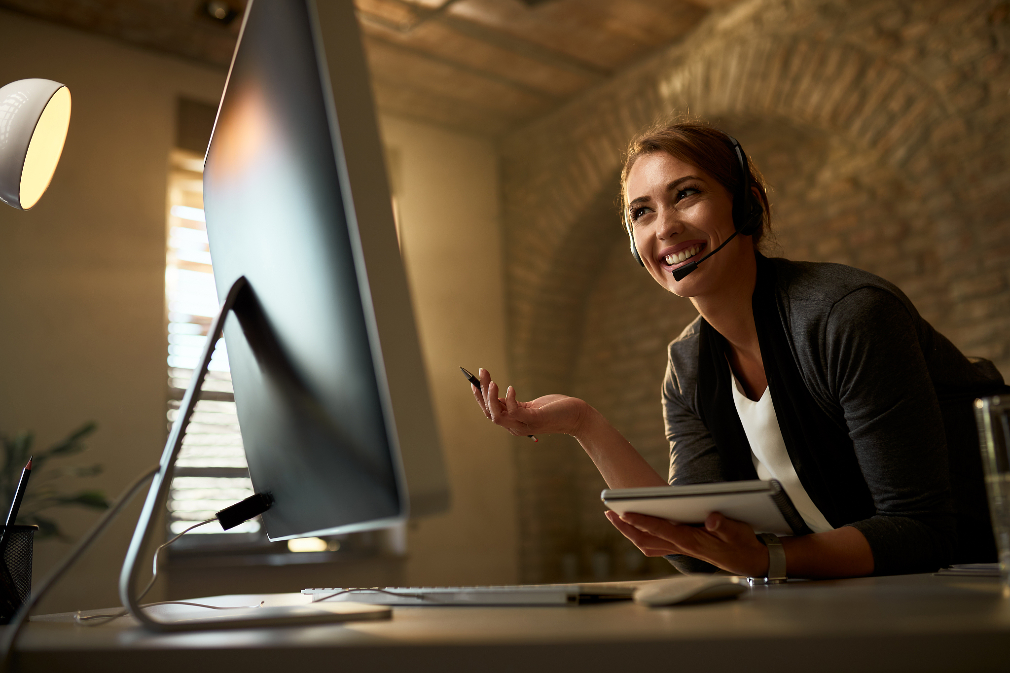 happy businesswoman having video conference over a computer in t