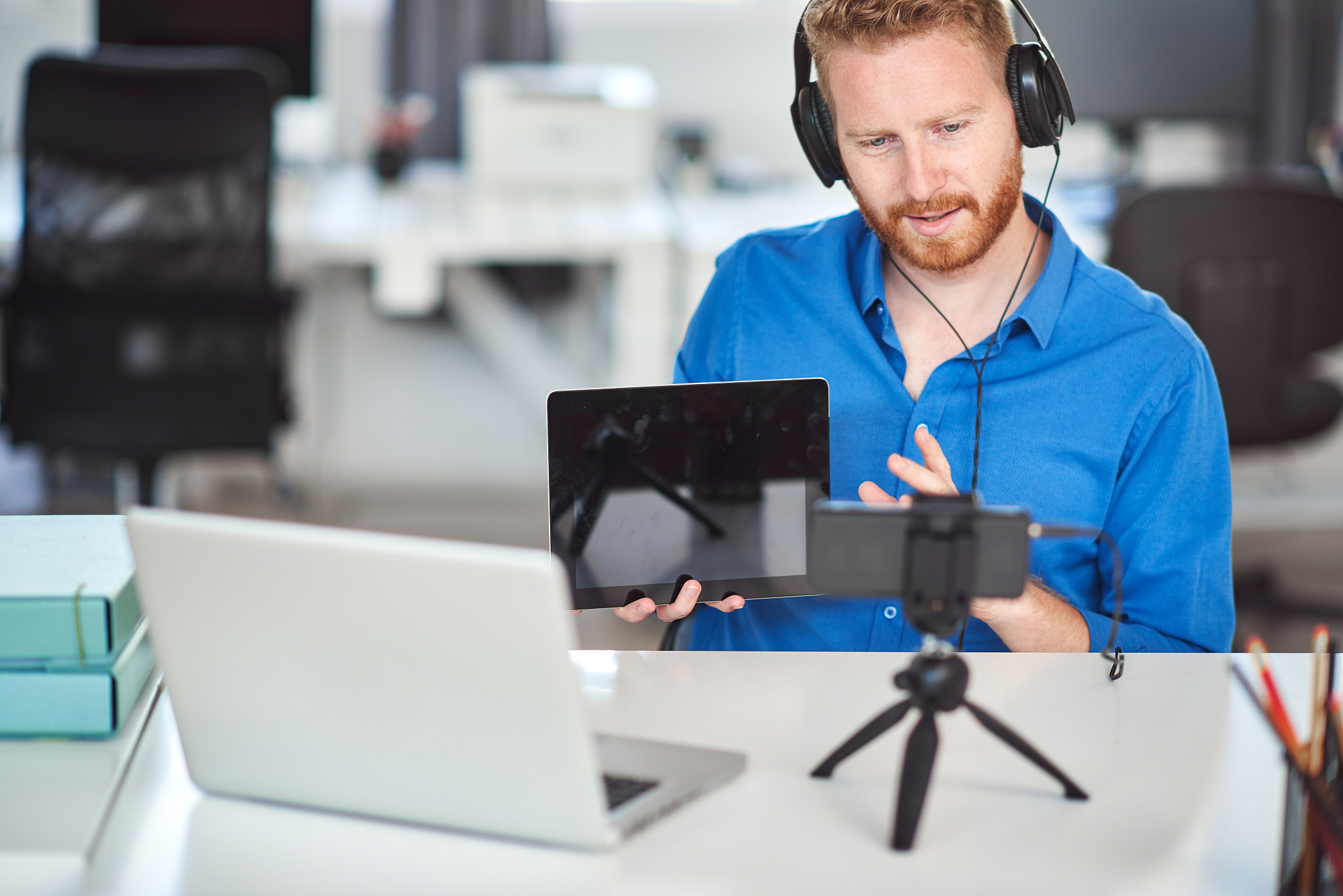 businessman having video call and showing tablet.
