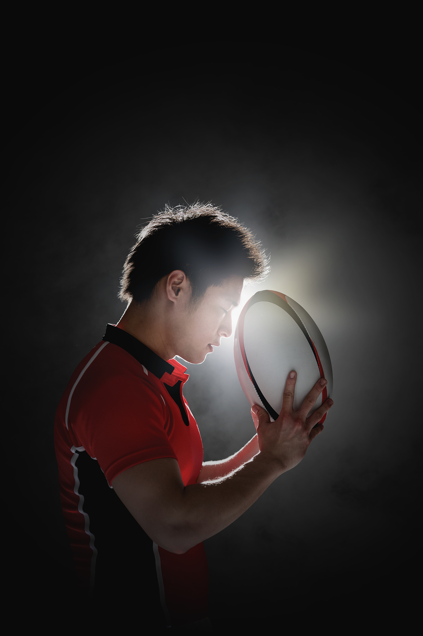 portrait of japanese rugby player with ball