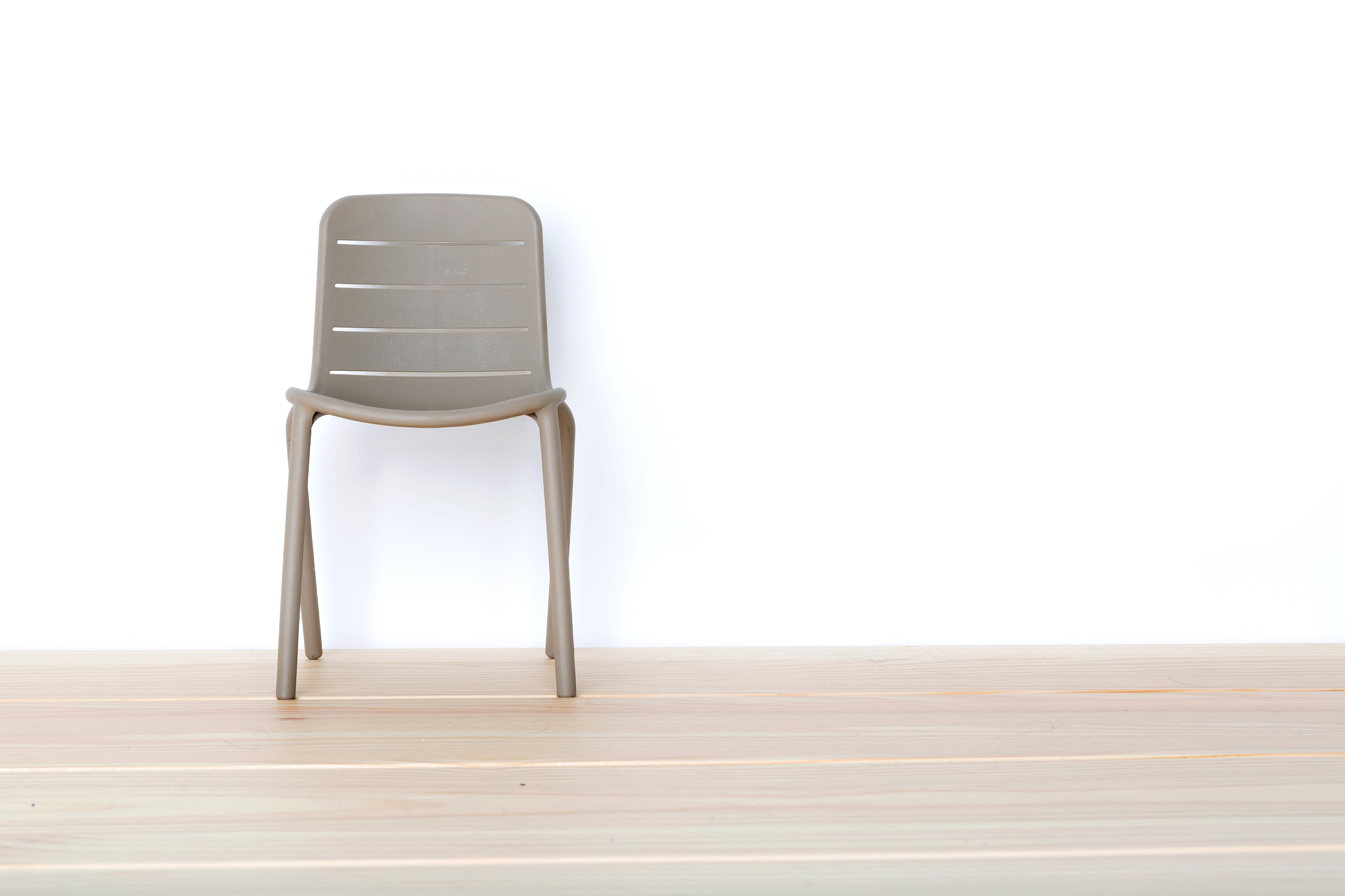 single chair against wall