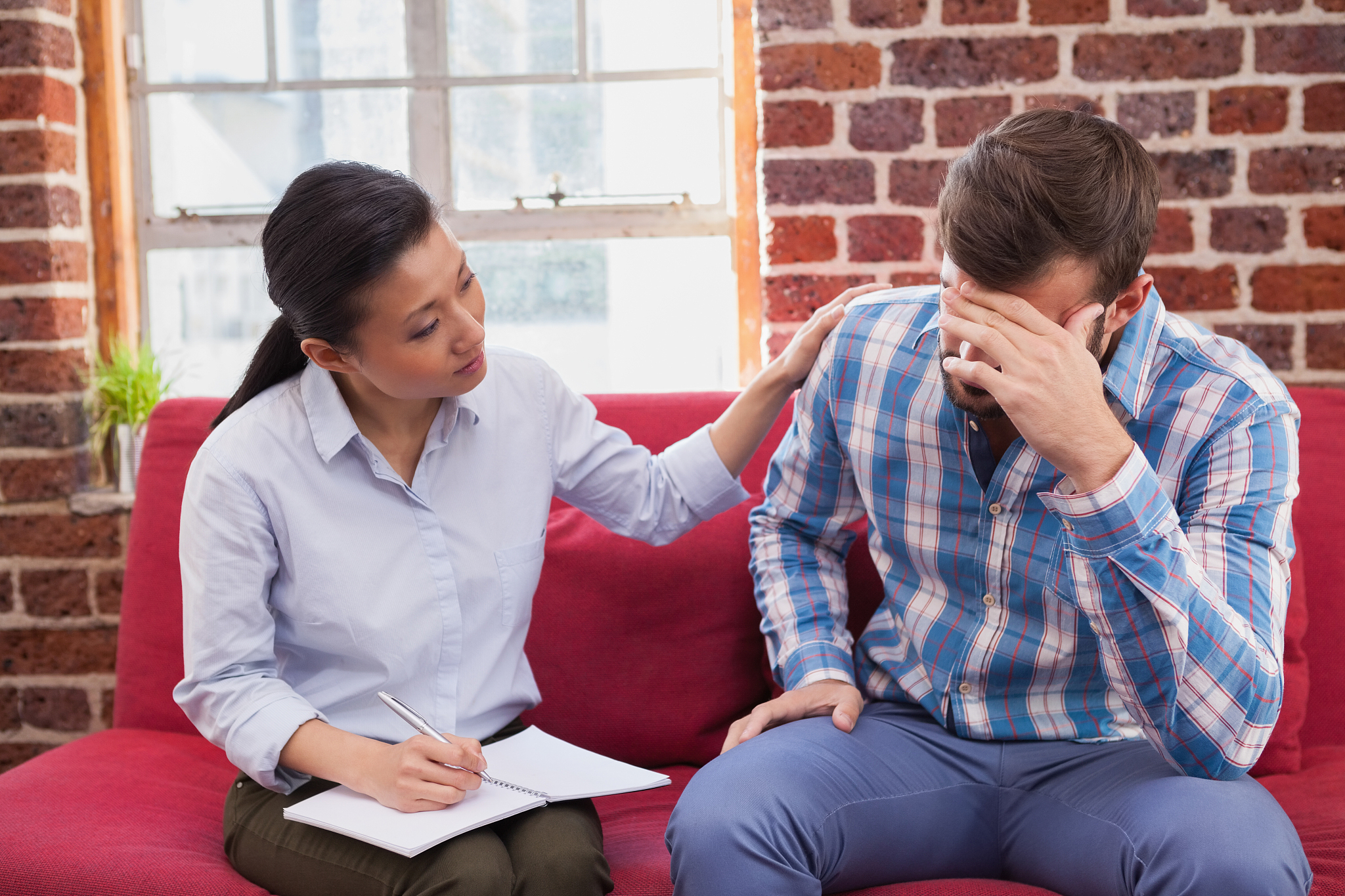therapist comforting her upset patient
