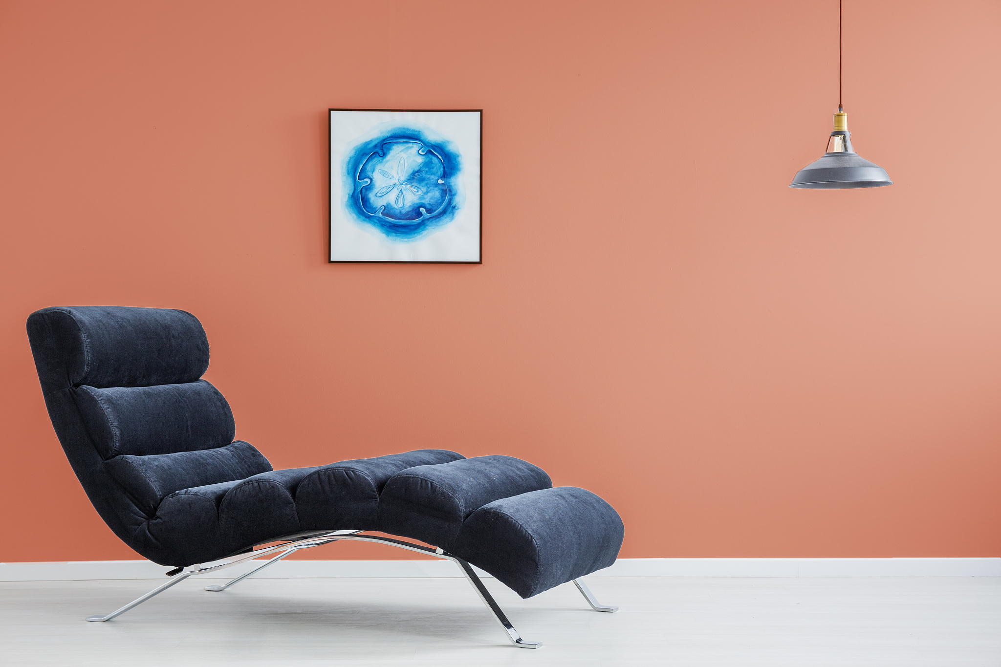 orange wall and blue couch