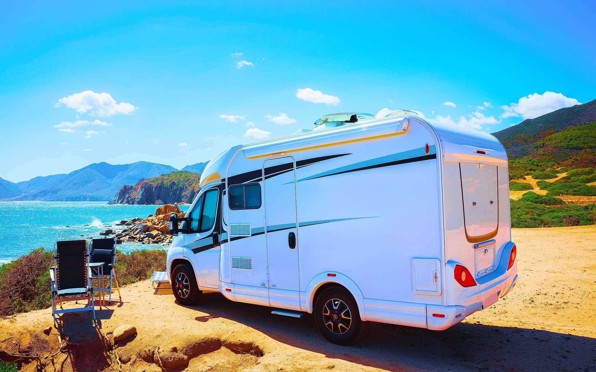 camper in capo pecora resort at mediterranean sea sardinia refle