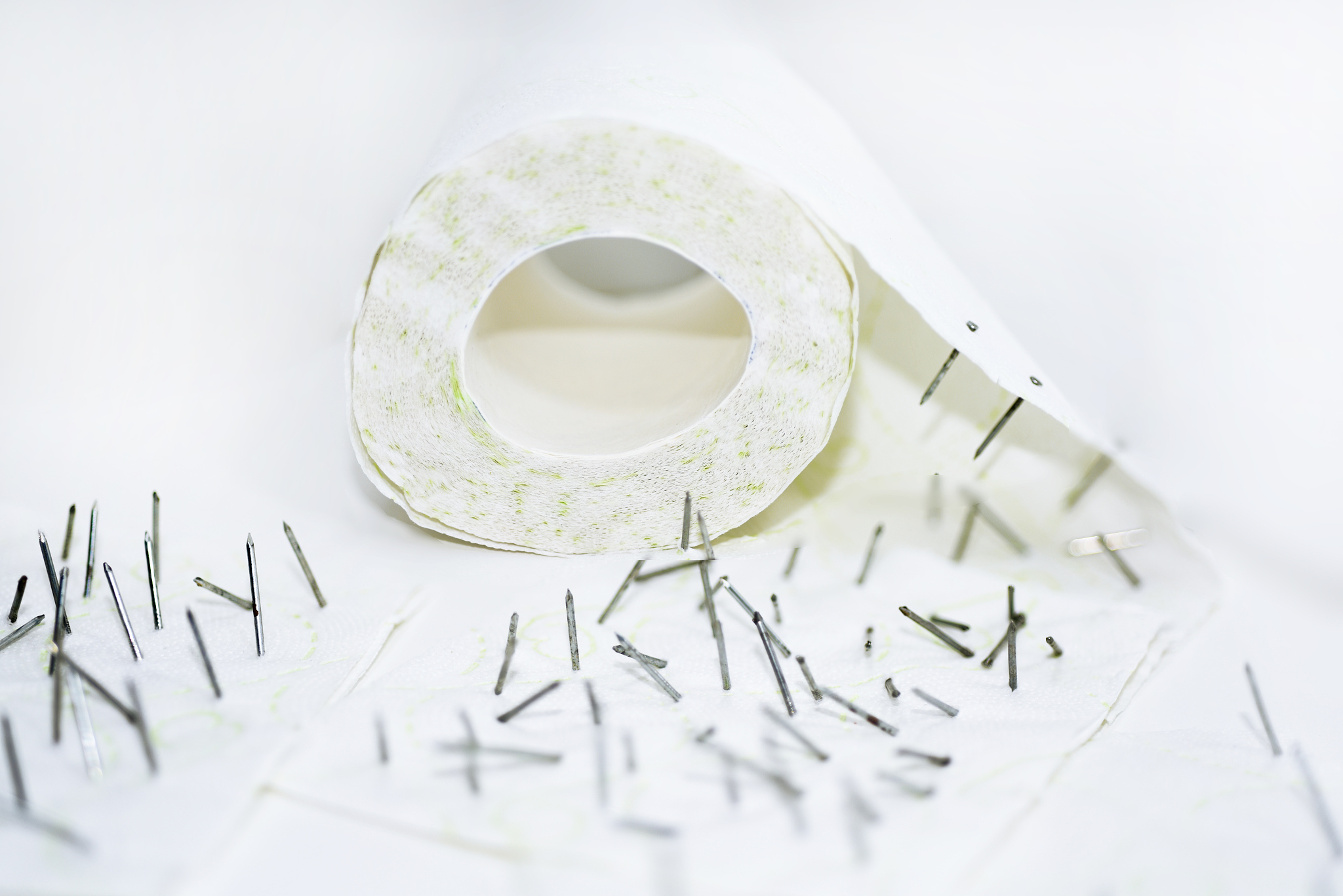 toilet paper with nails in it.