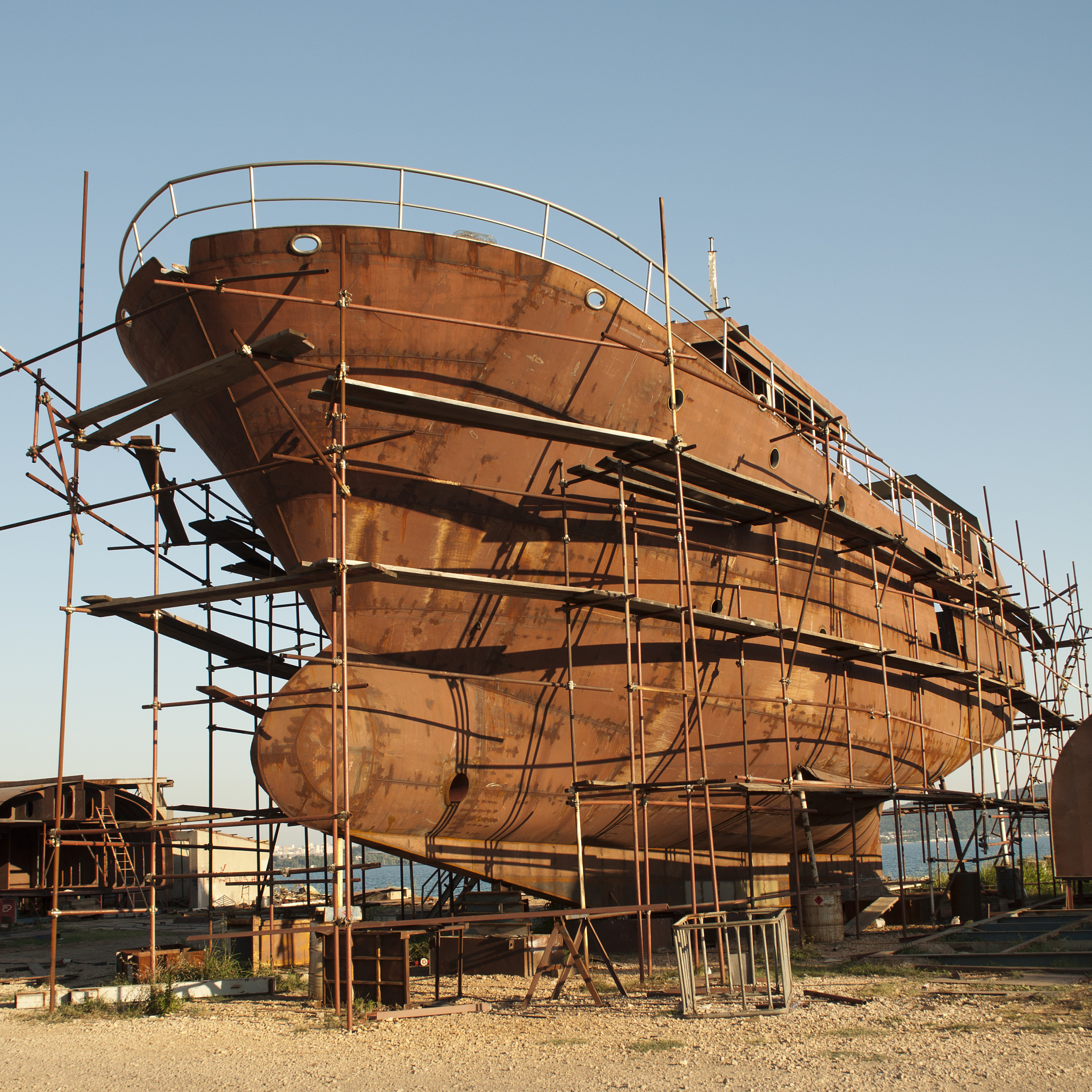 Where are the sections in a ship that are examined for longitudinal strength calculation and why