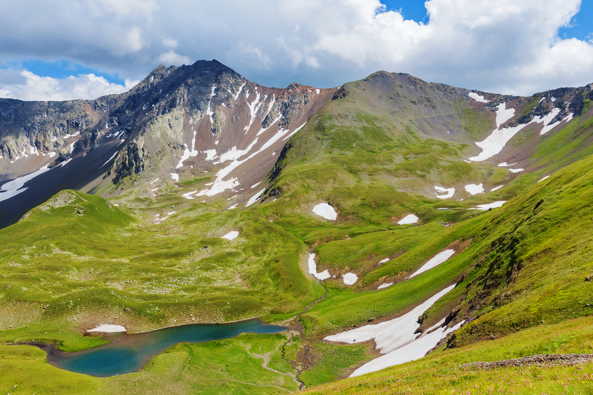 green lake in a summer mountain valley