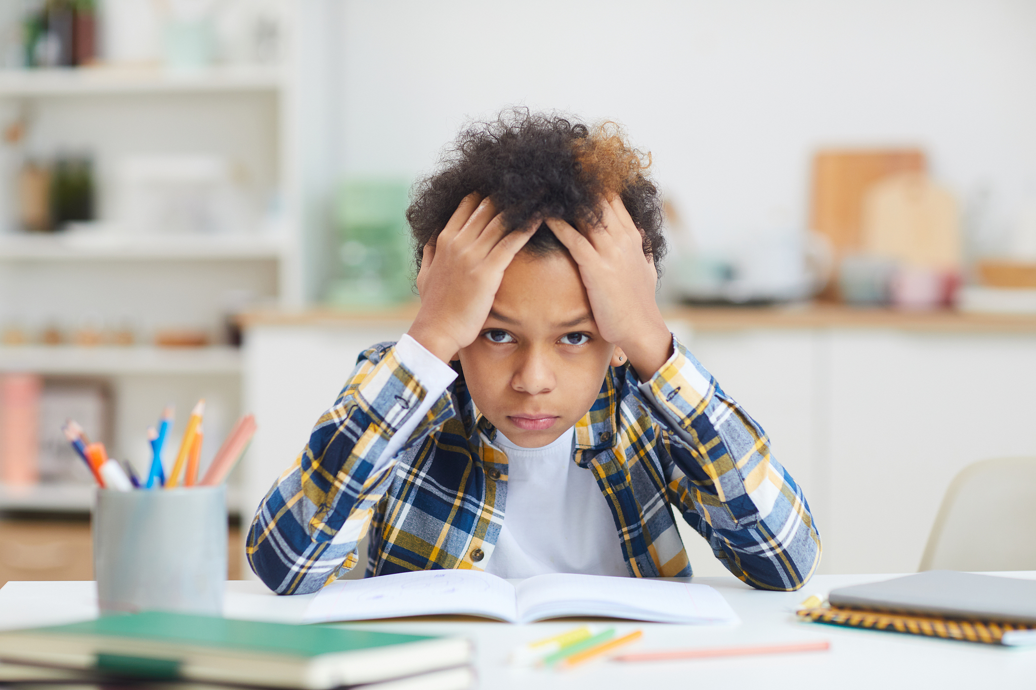 african-american boy studying at home