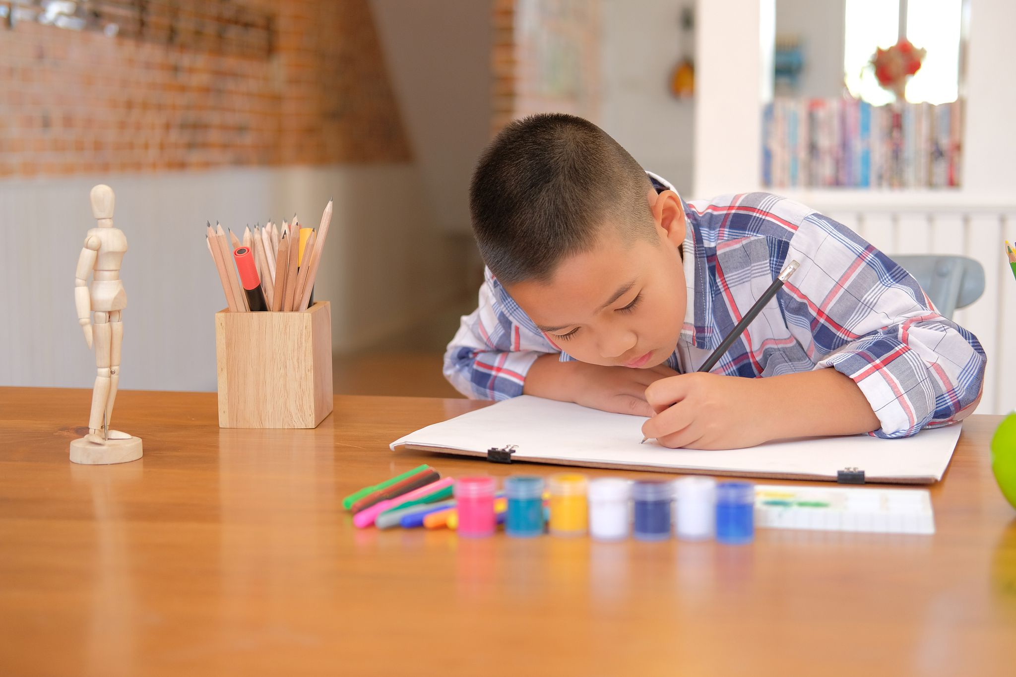 asian kid boy child schoolboy drawing picture. children activity
