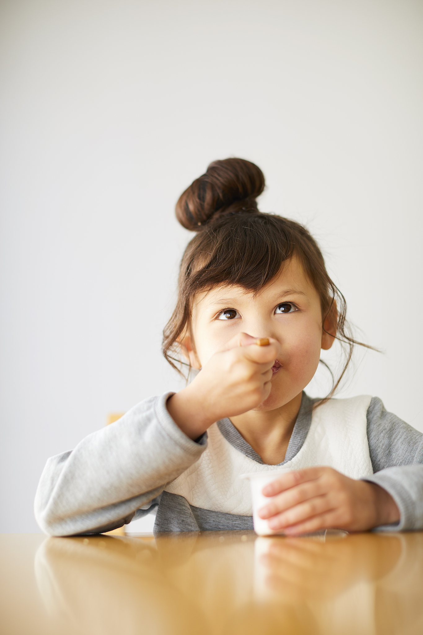 cute japanese kid having a snack