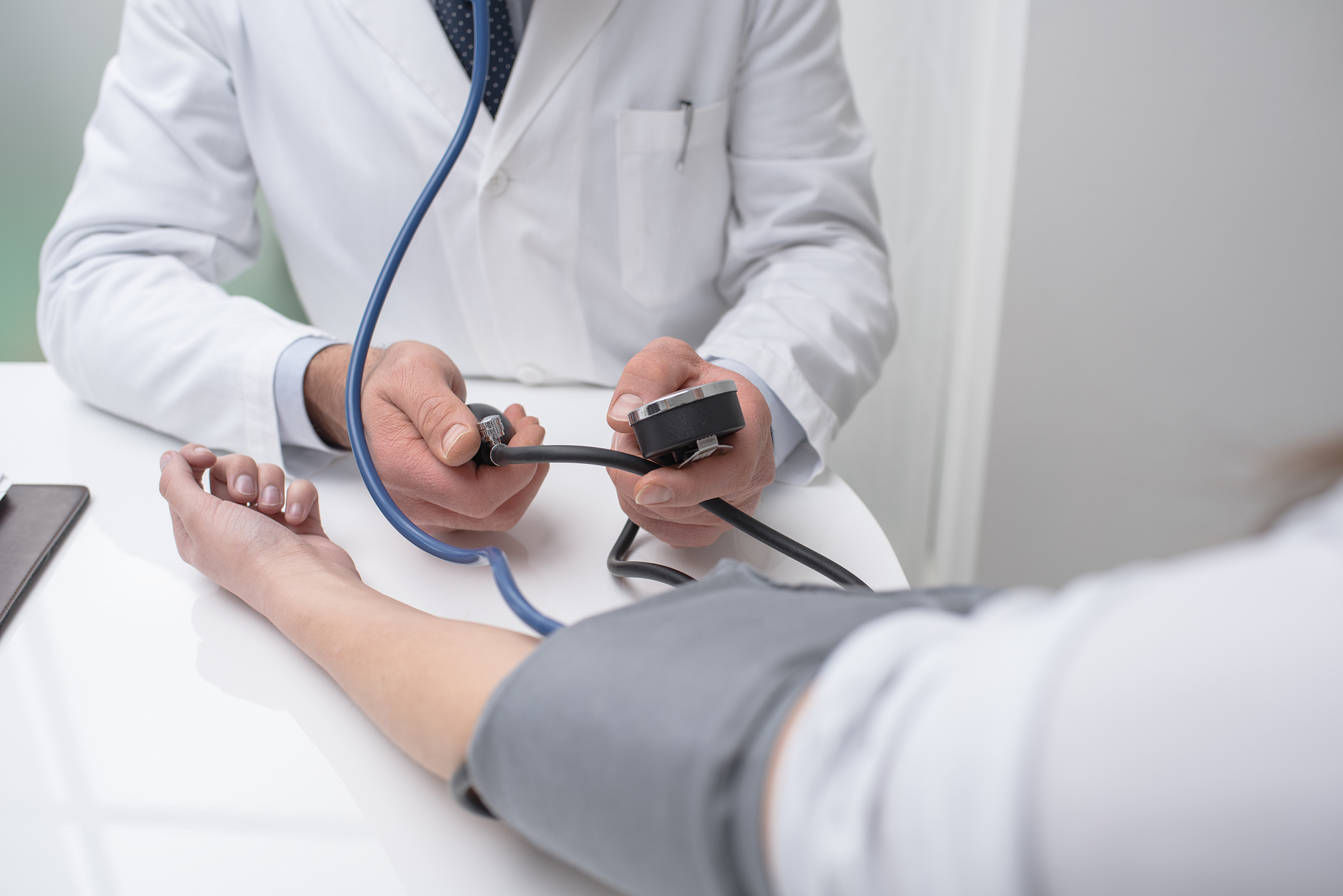 doctor measuring pressure