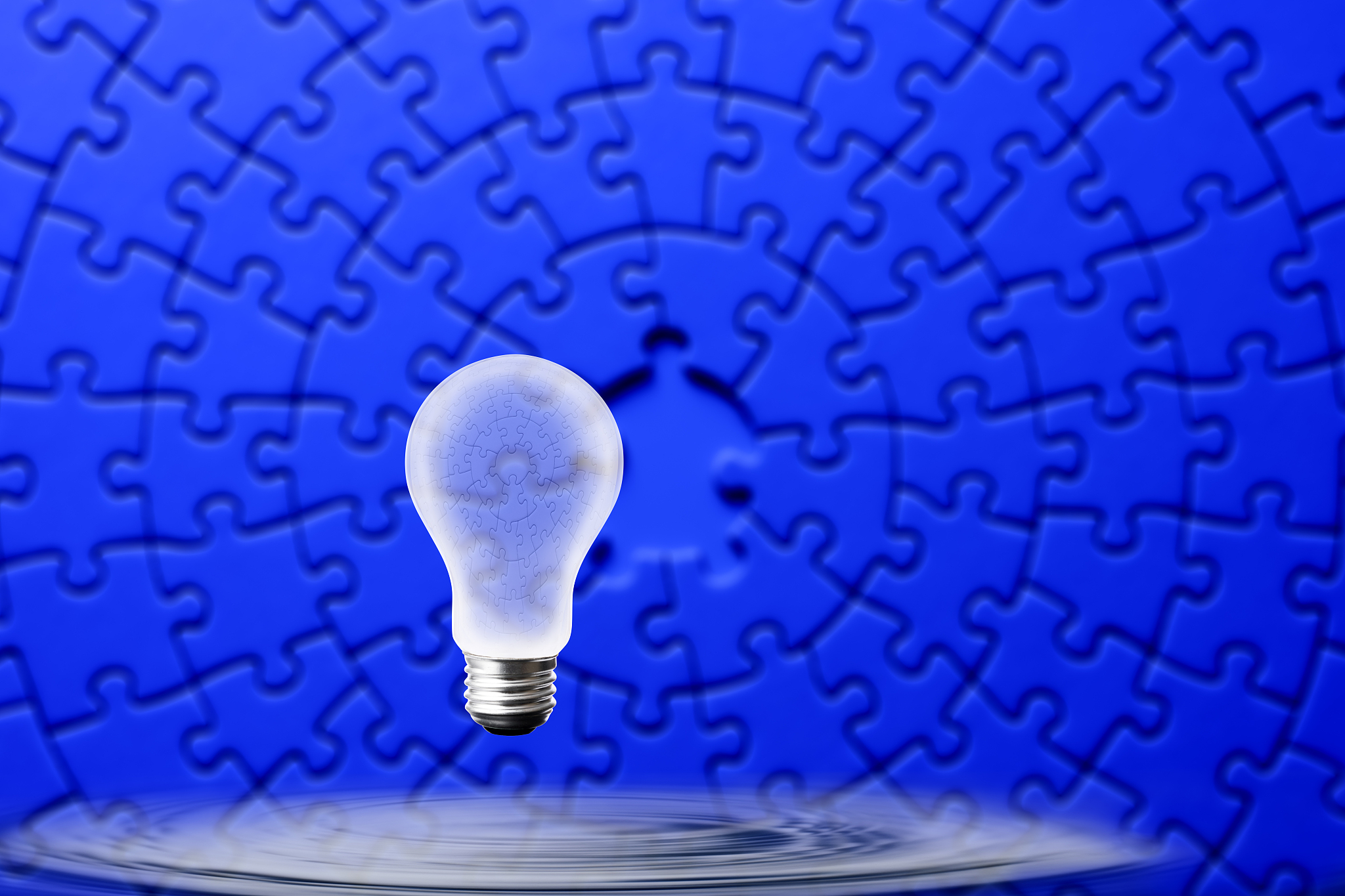 light bulb floating in mid-air of the water surface
