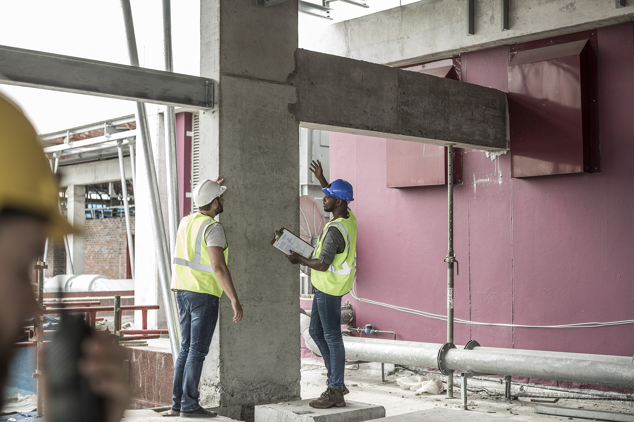 construction workers discussing in construction site