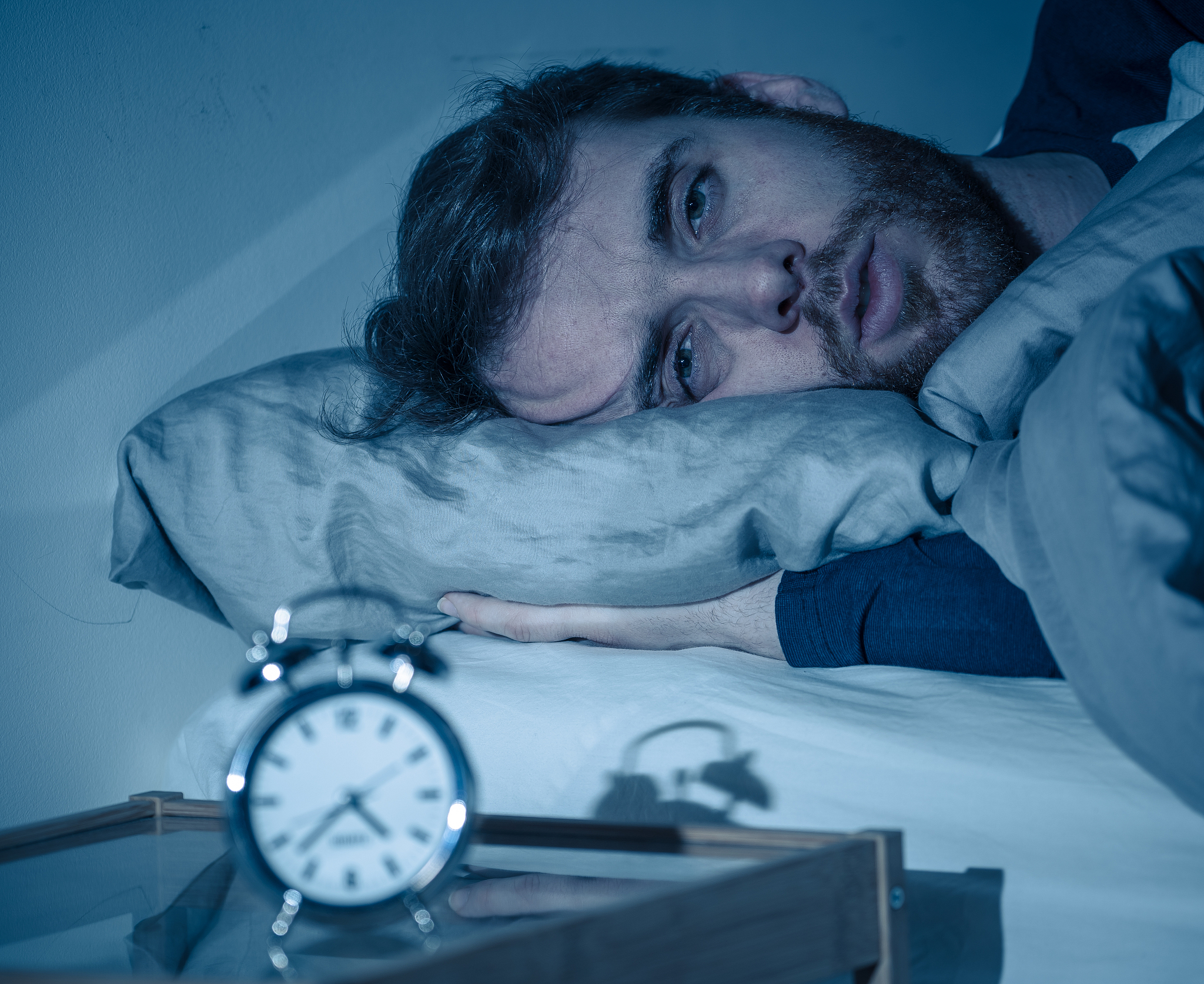 sleepless and desperate young caucasian man awake at night not a