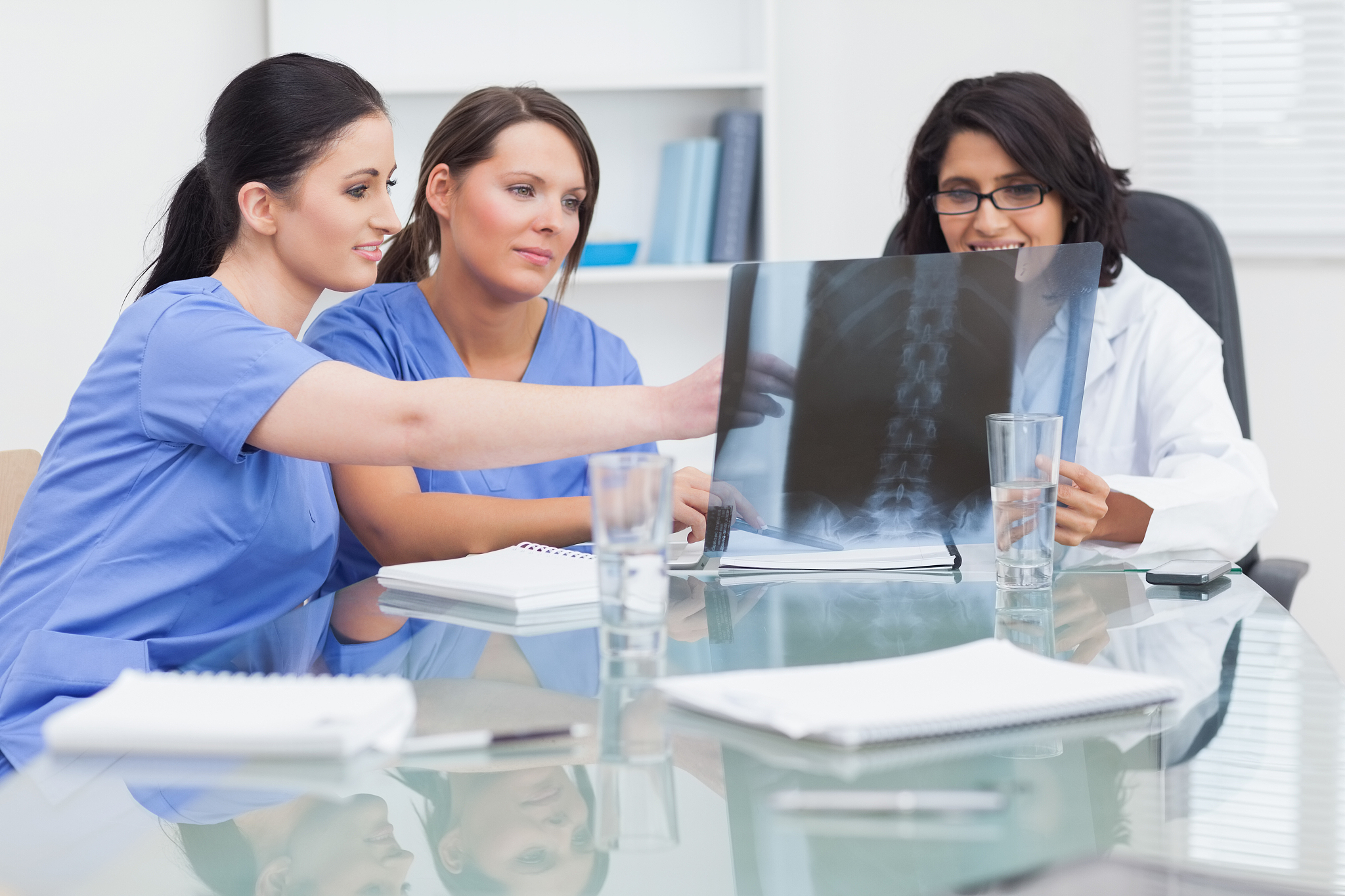 nurse and doctor looking at xray