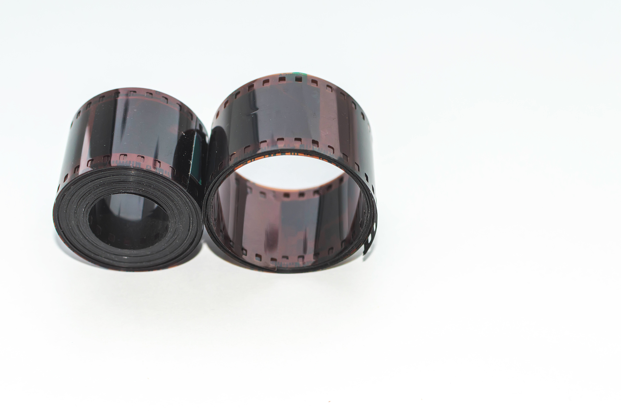 film in rolls on a white background. outdated technology. retro.