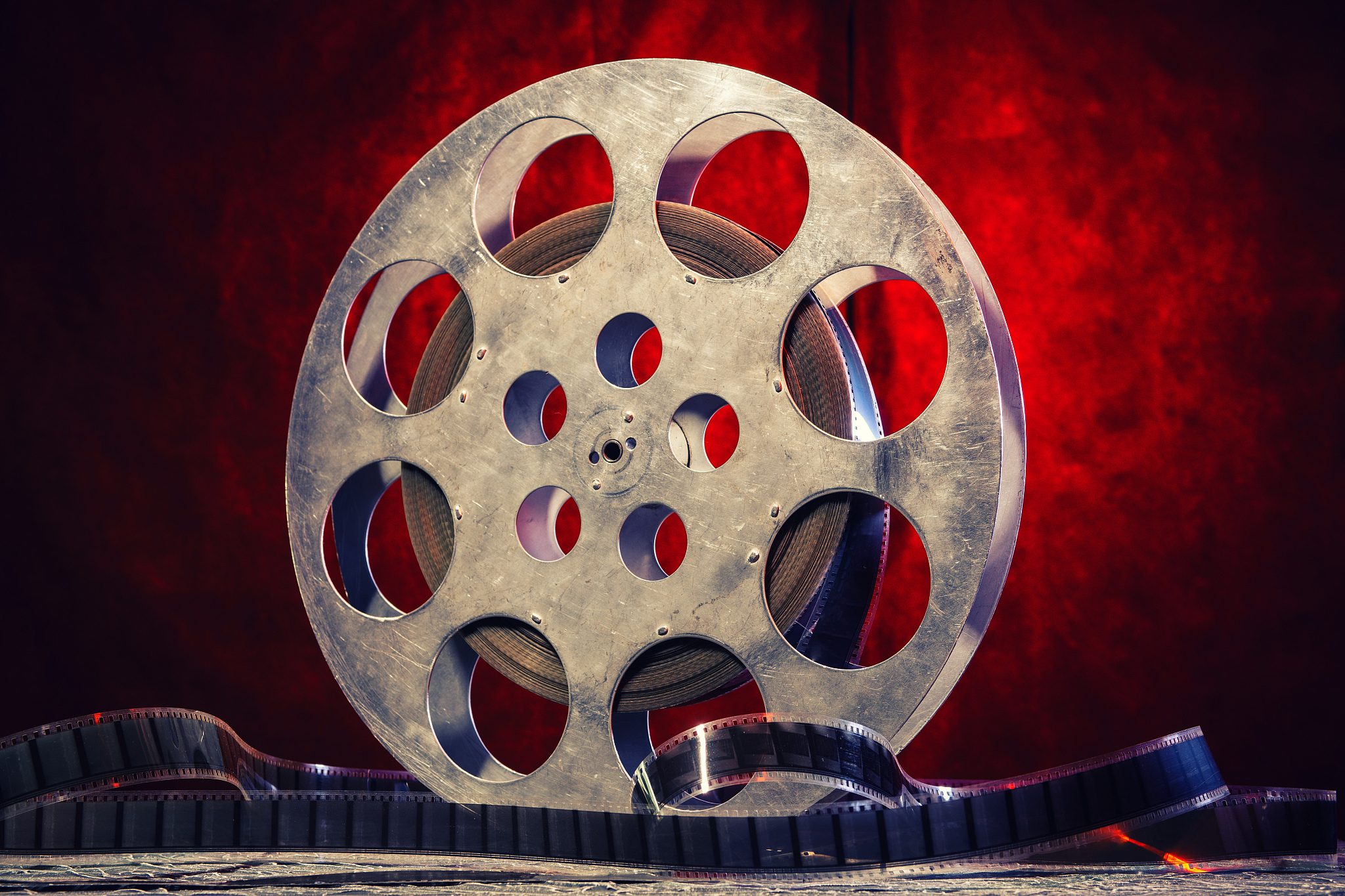 35 mm film reel with dramatic lighting on a dark background
