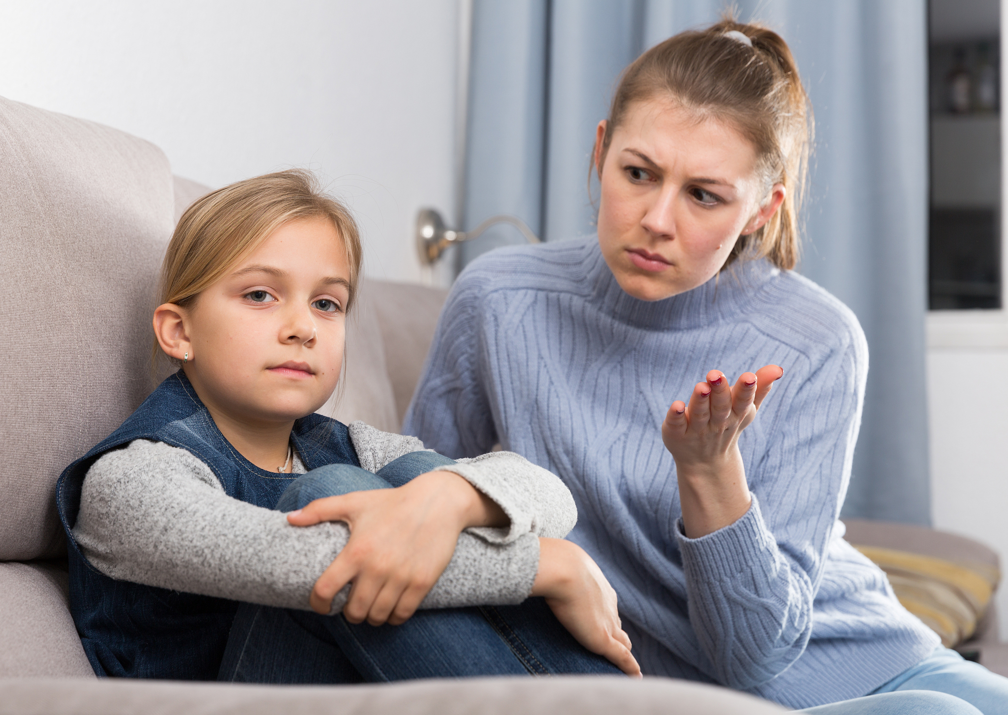 mom scolds little daughter. crisis of motherhood