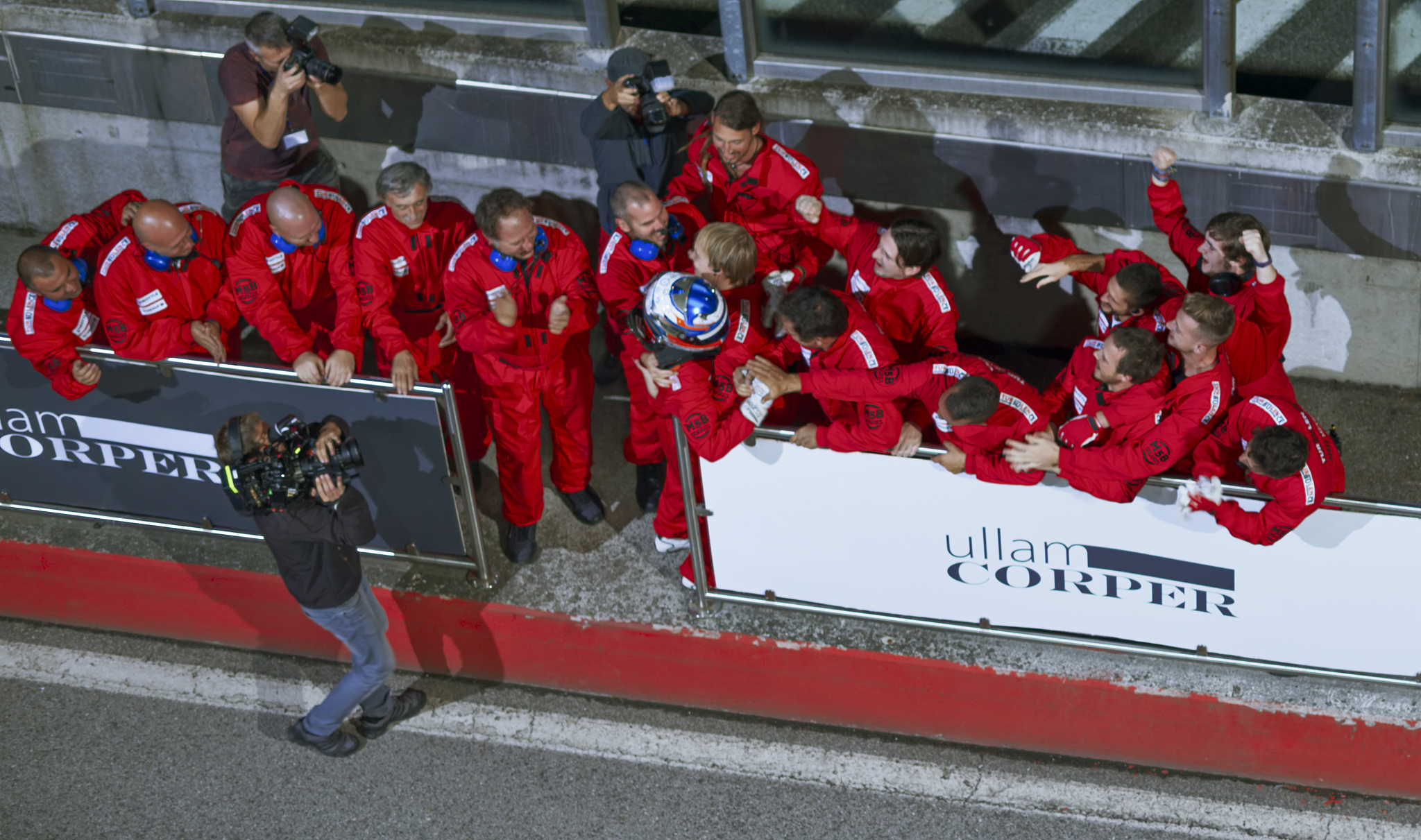 racing team celebrating victory
