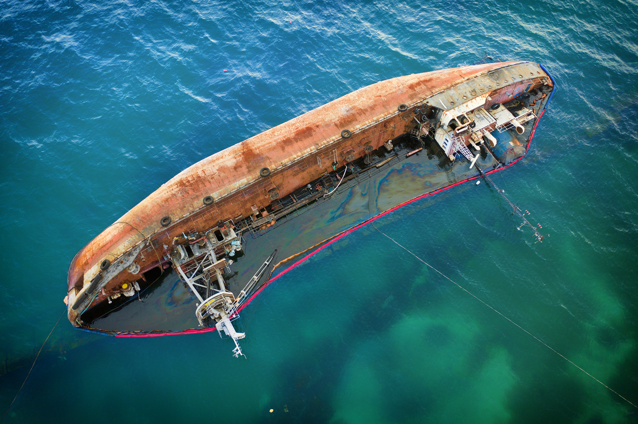 tanker after the accident, overturned in the water.