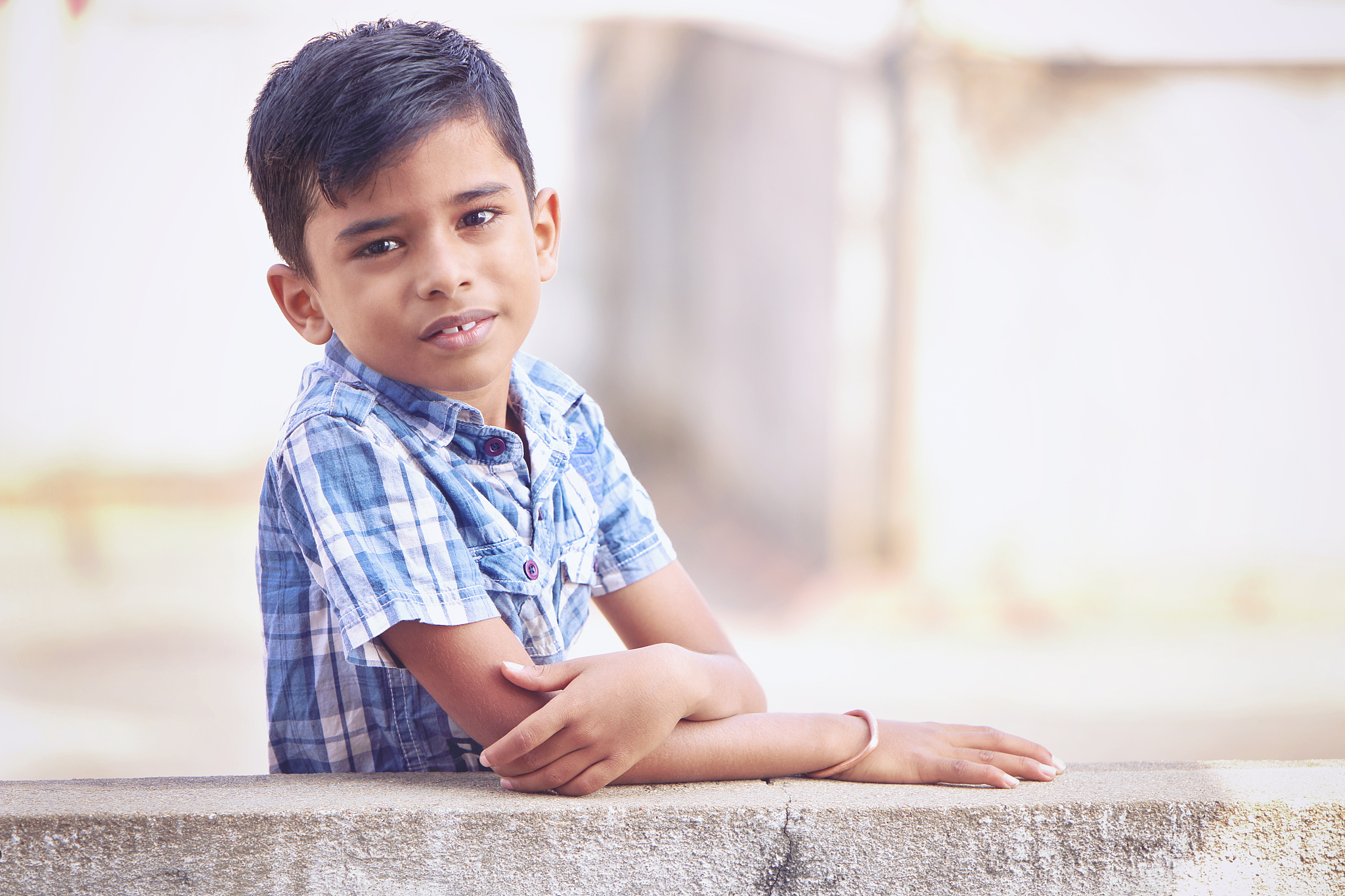 little boy posing to camera with expression