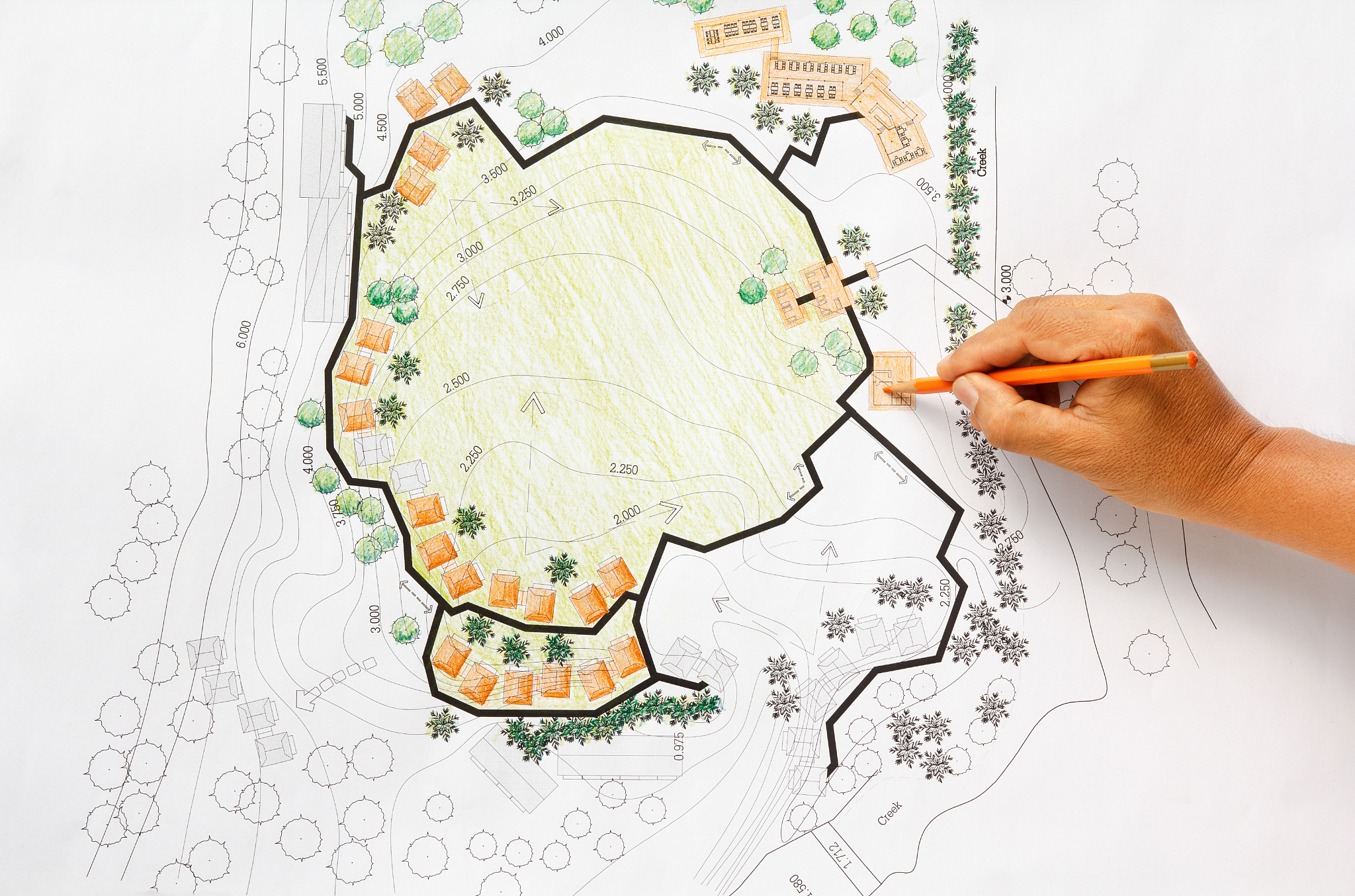 landscape architect designing on site analysis plan for resort.