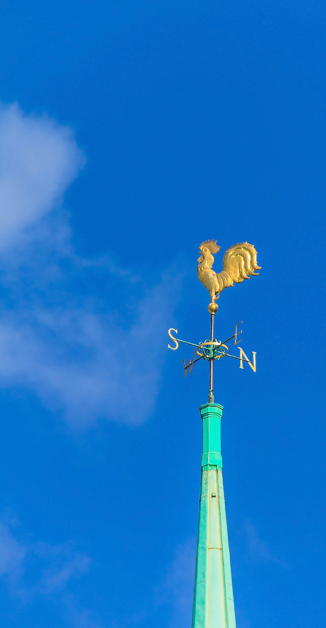 golden cockerel on spire of  anglican church at   trinity square