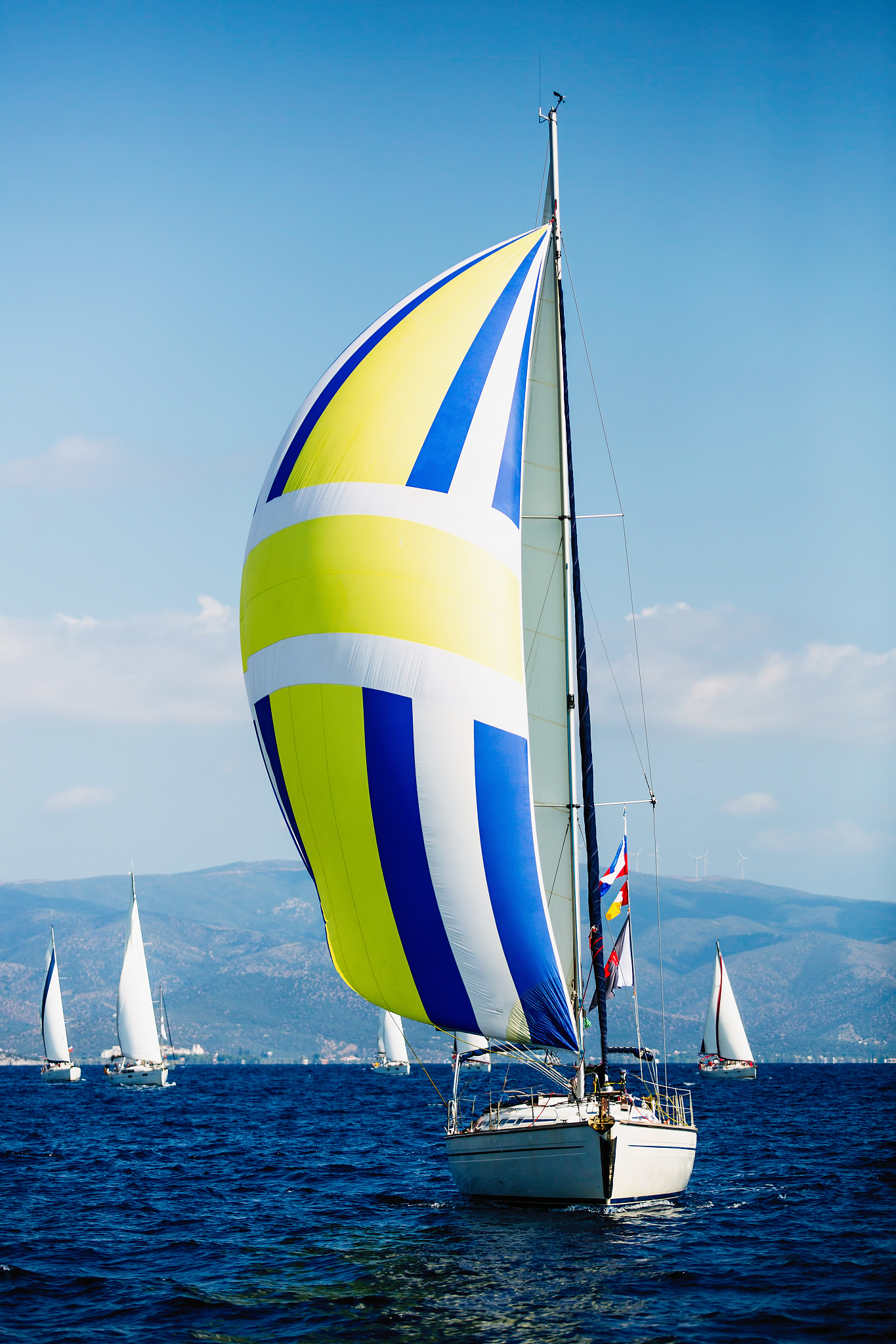 luxury yacht with color sails at regatta. sailing in the wind th