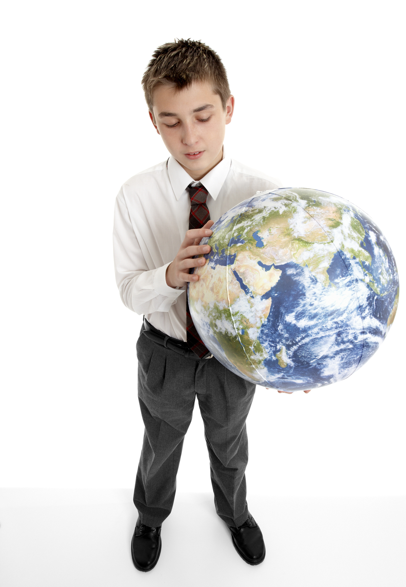 boy holding blow up ball of the earth world