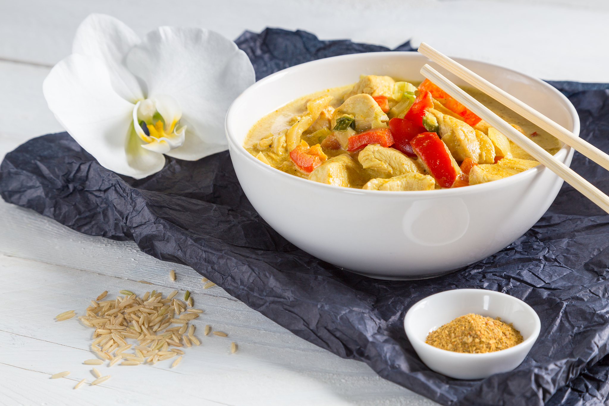 thai curry in a bowl on wood