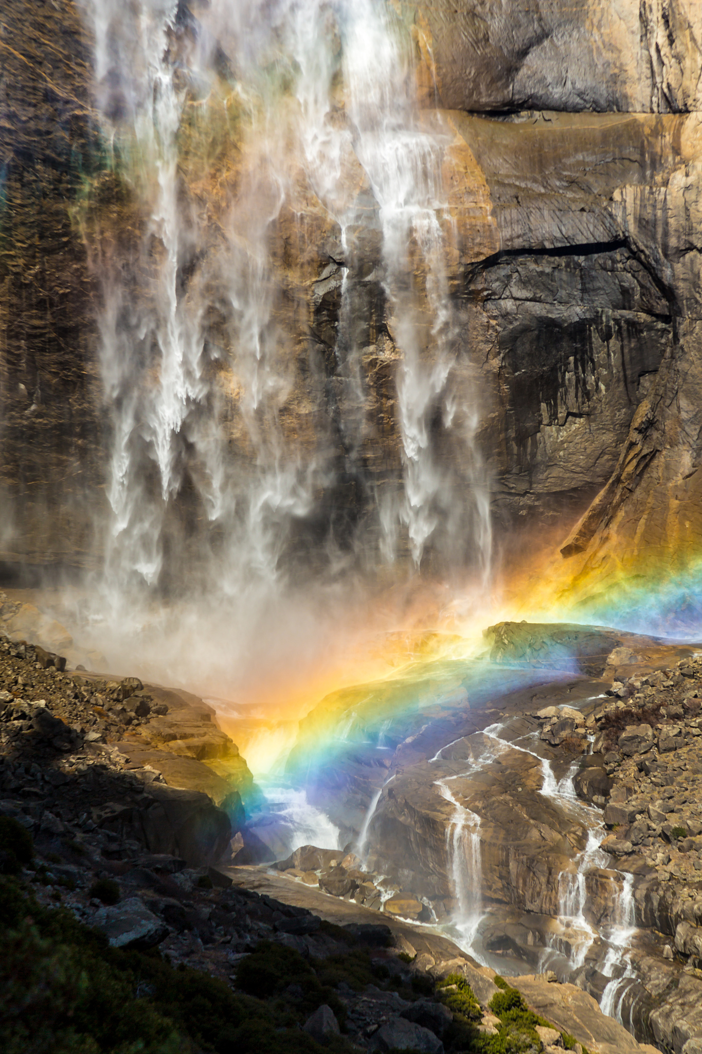 rainbow over waterfall