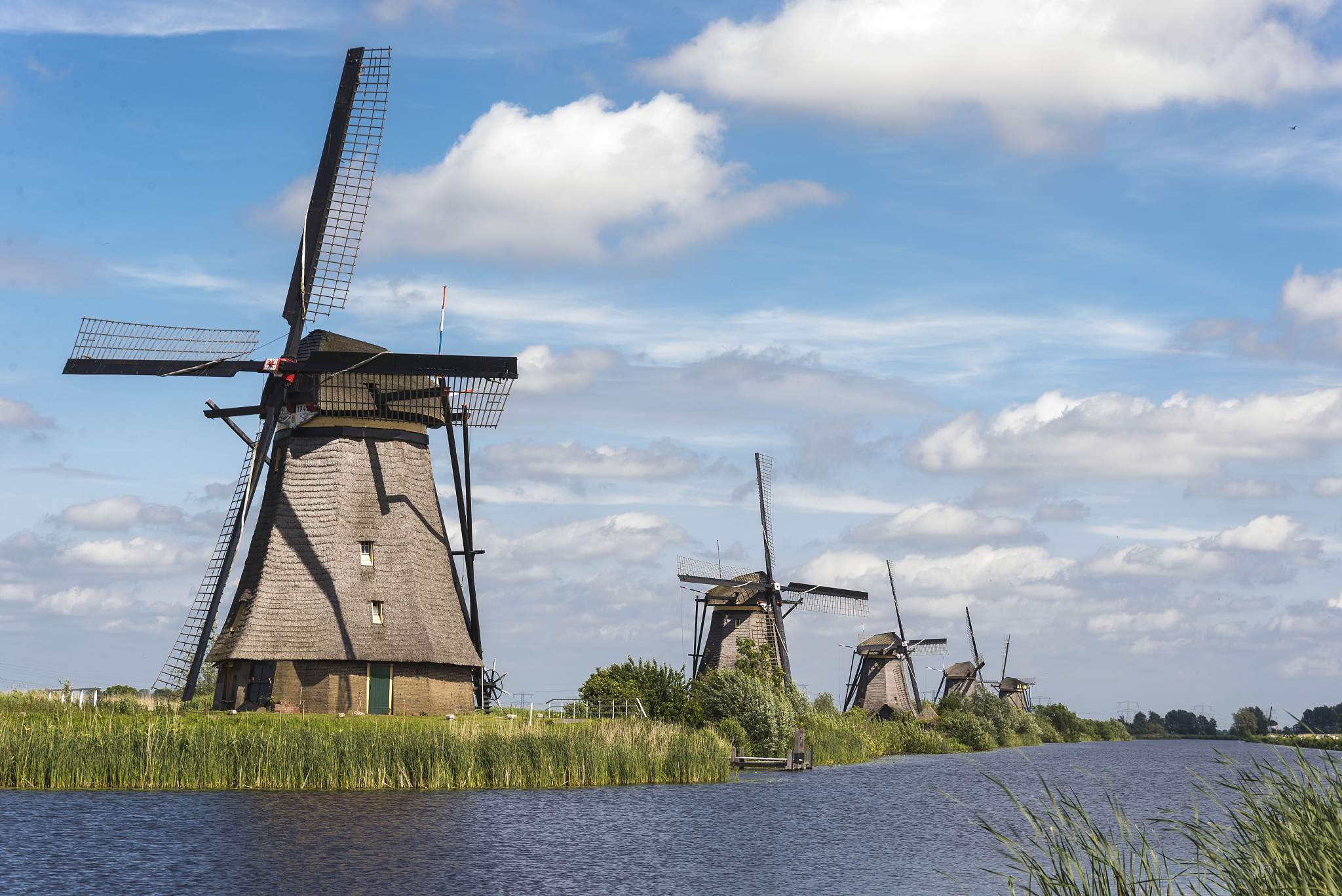 row of windmills in kinderdijk