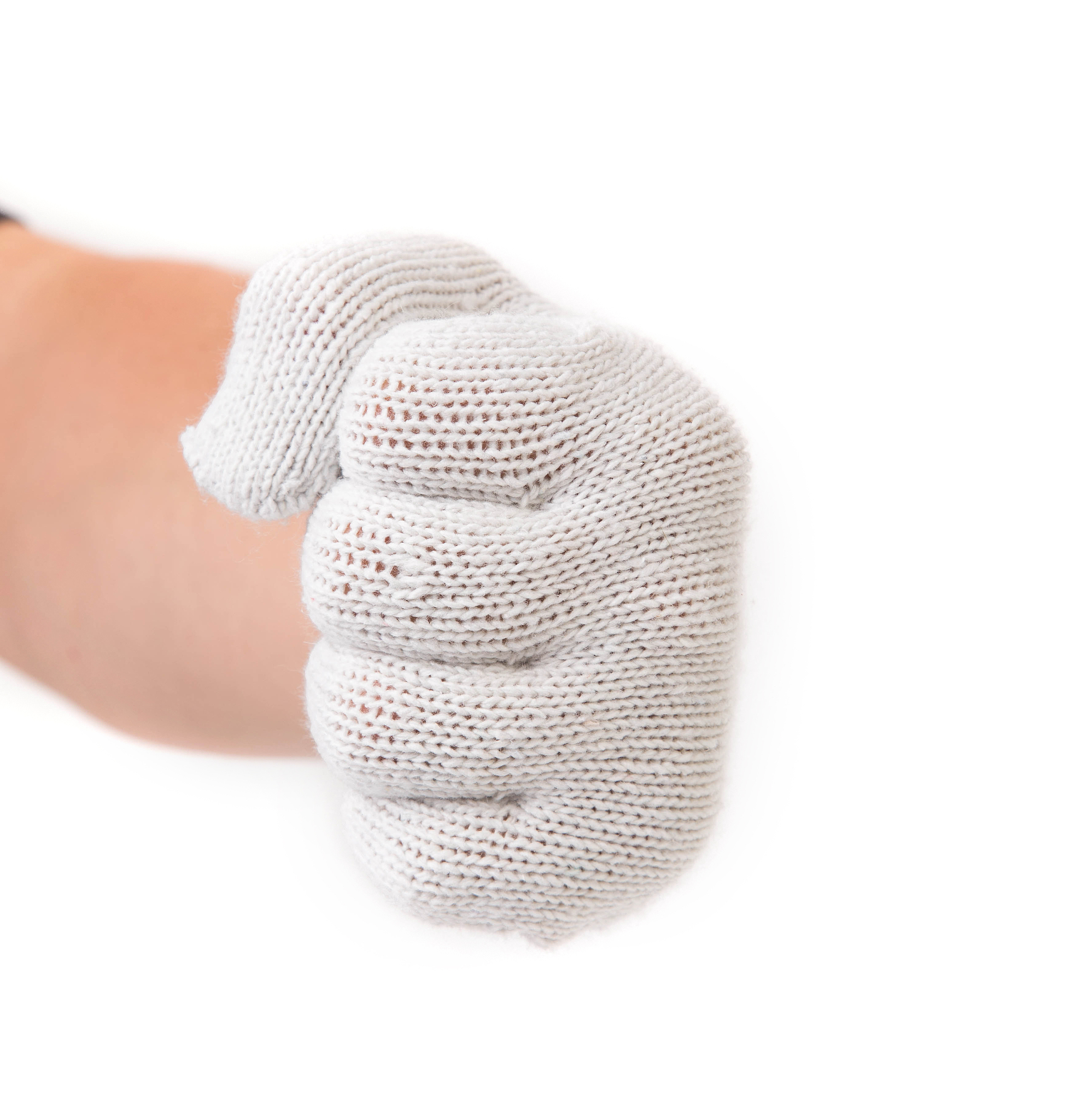 strong male fist in a knitted glove.