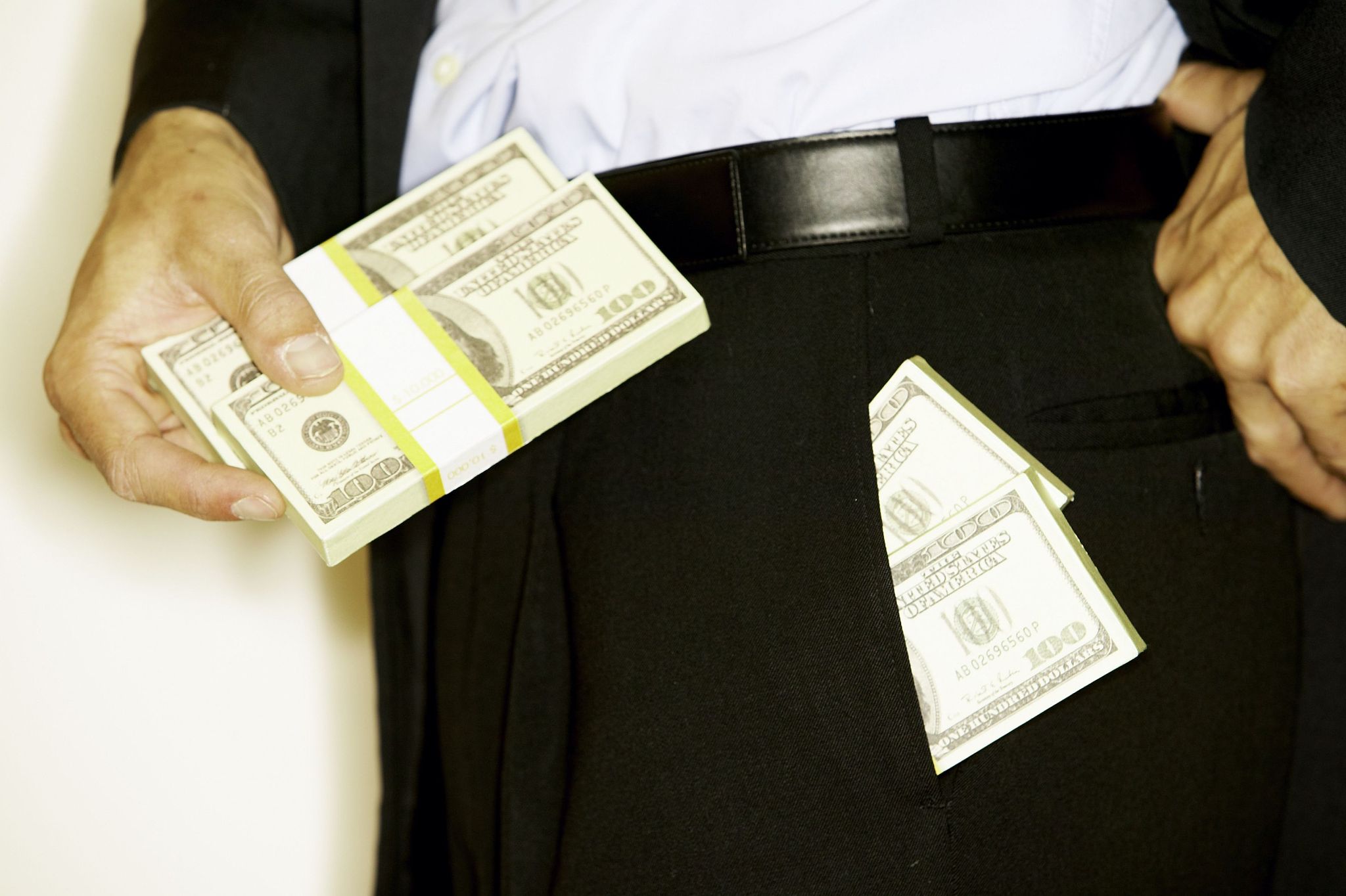 man with money in pocket