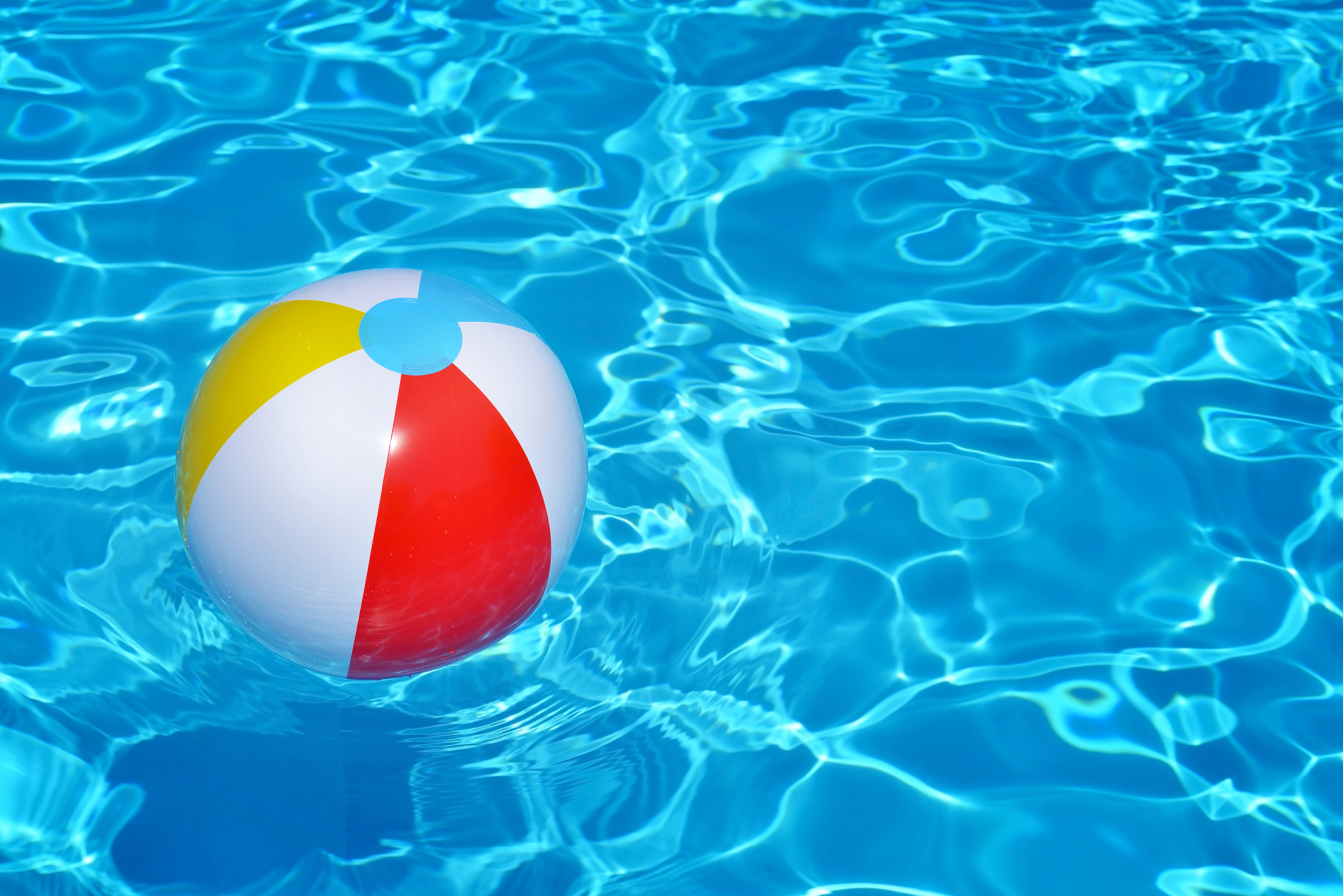 colorful inflatable ball floating in swimming pool