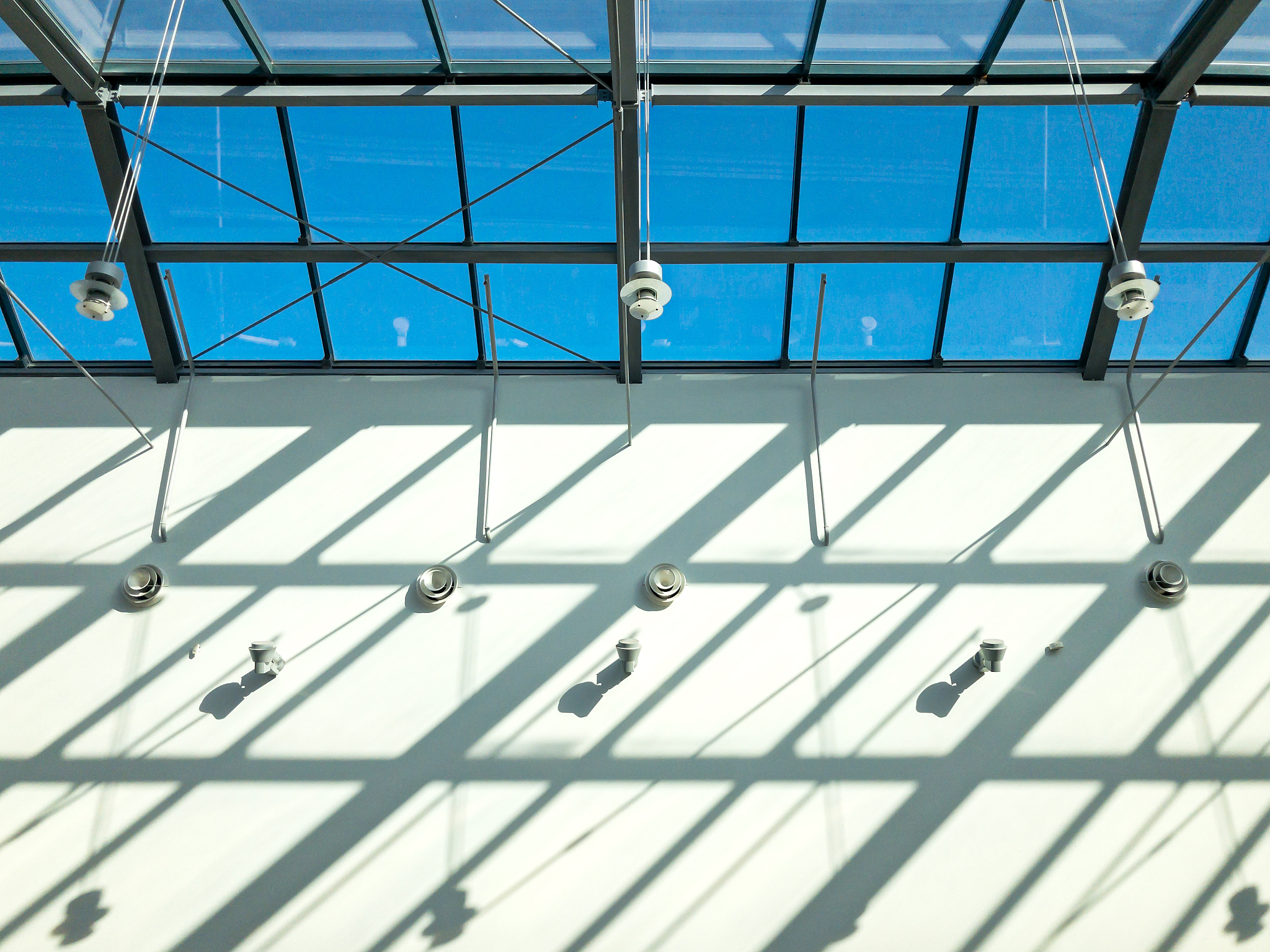 glass roof of modern building. sunlight through the roof