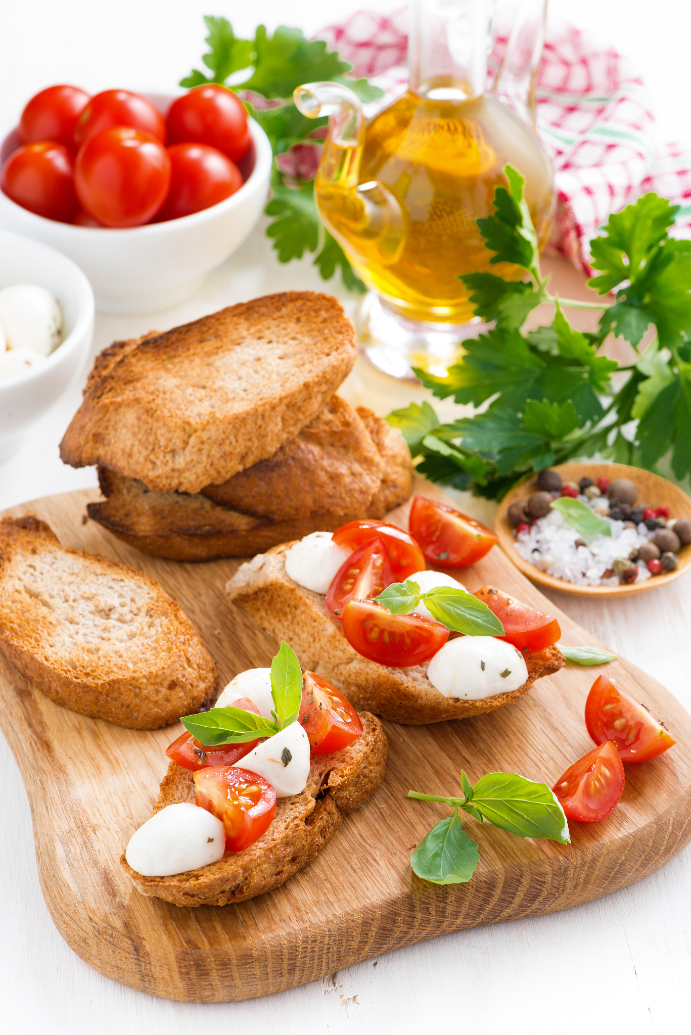 toasts with mozzarella, basil and cherry tomatoes