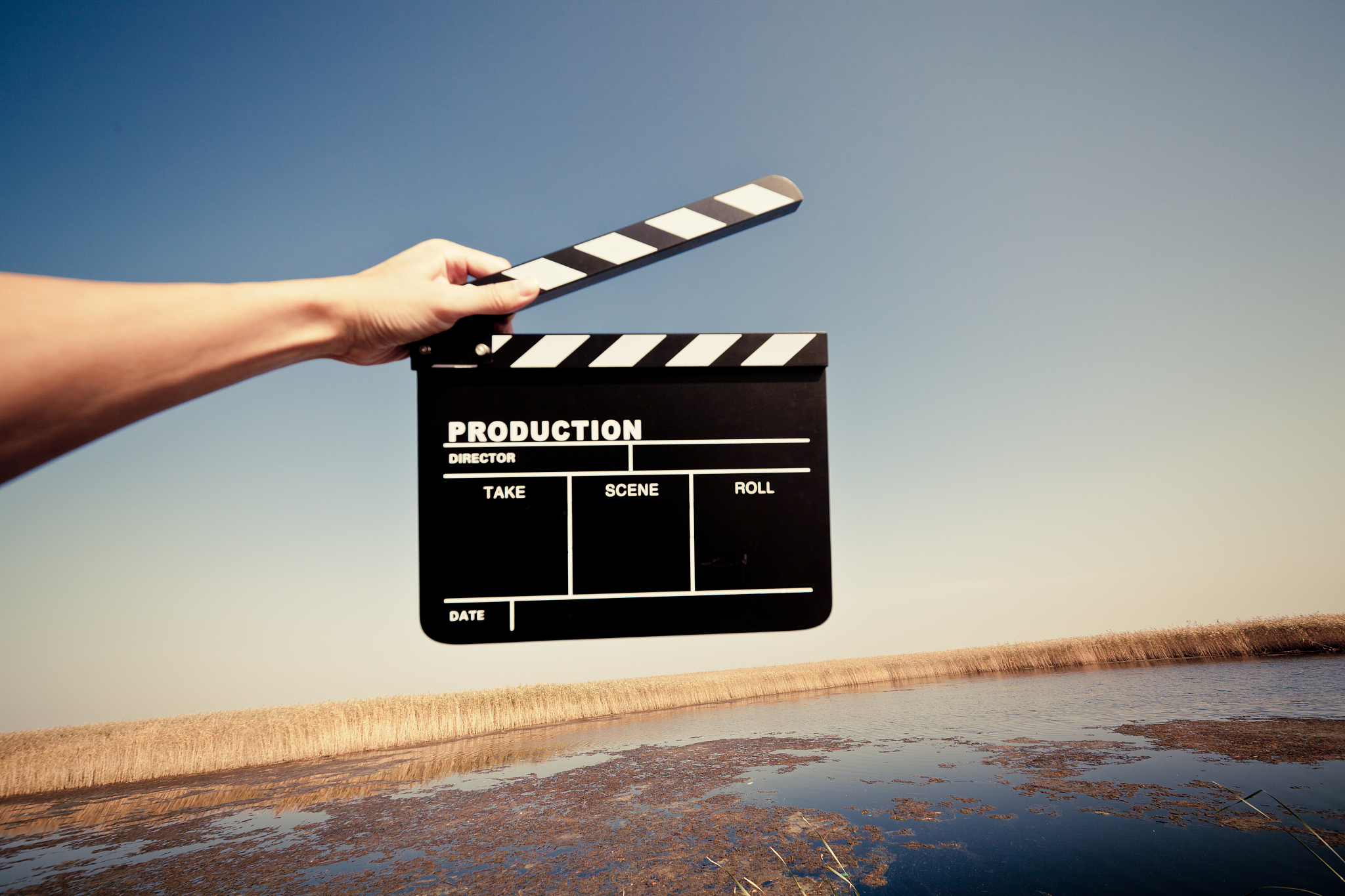 hands holding a movie clapboard