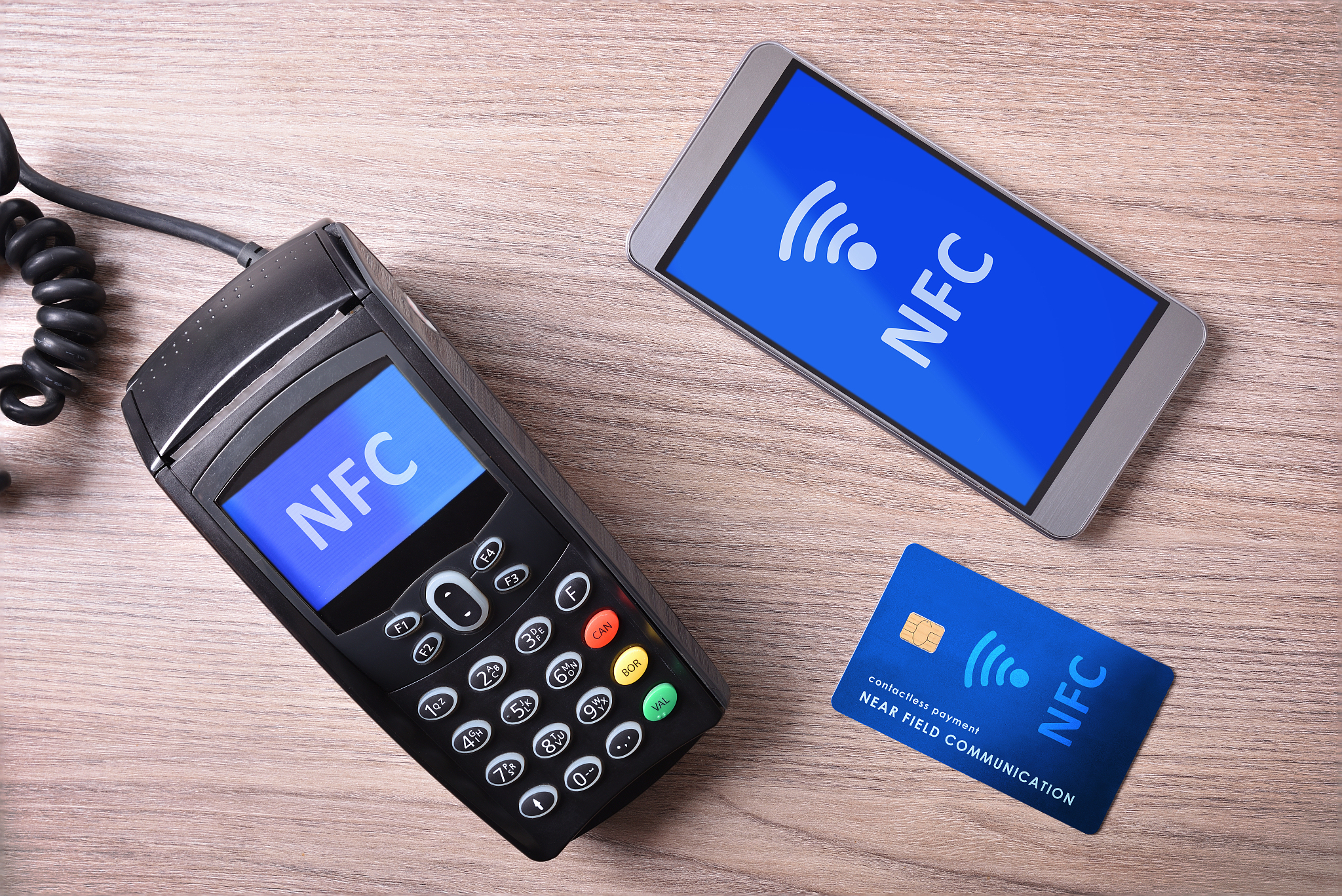 pos card and mobile on wood table nfc transmision system