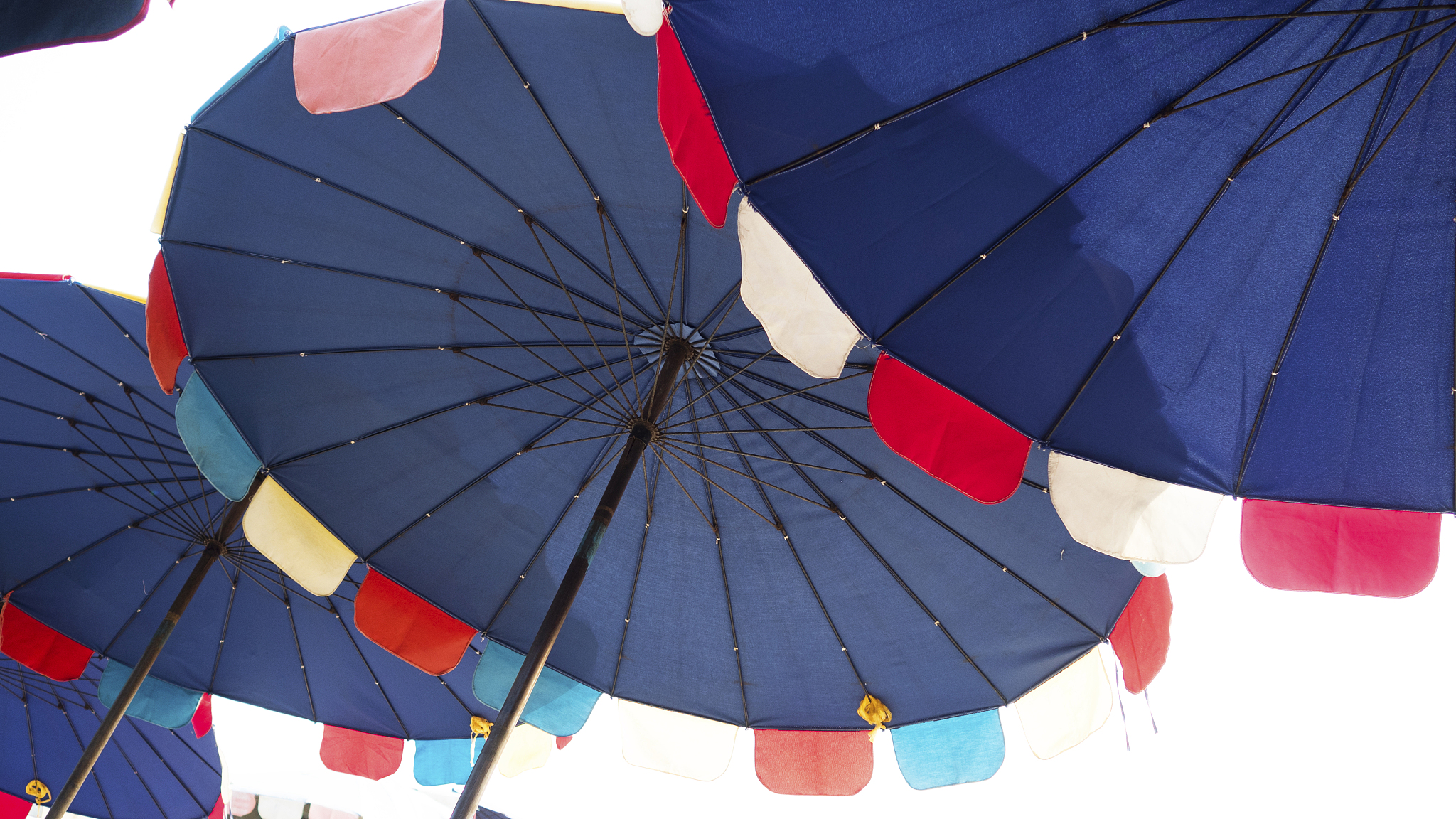 low angle view of parasol against sky