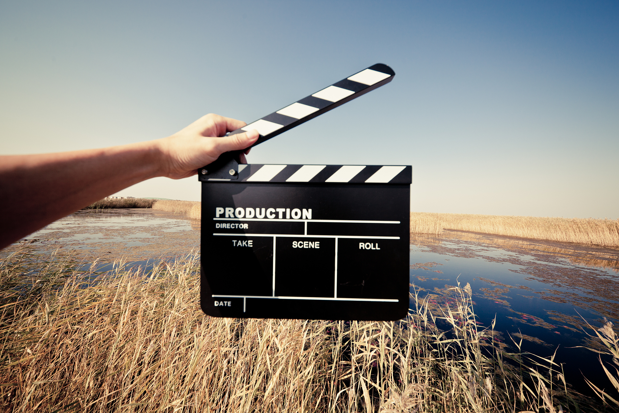 hands holding a movie clapboard