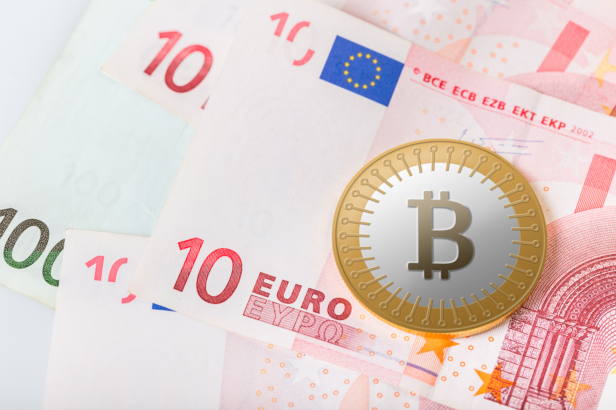 bitcoin on background of euro