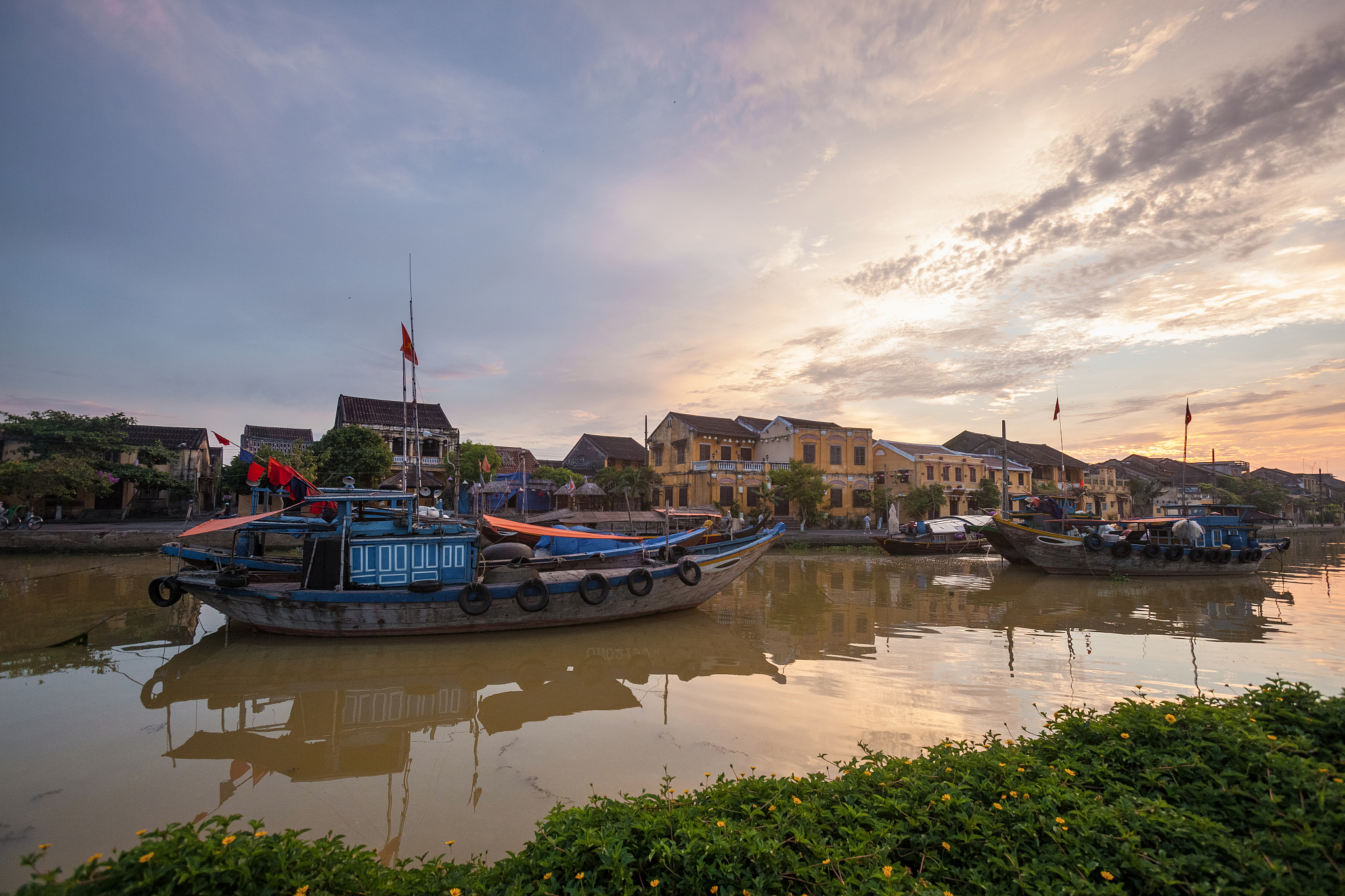 hoi an ancient town riverside at dusk, vietnam