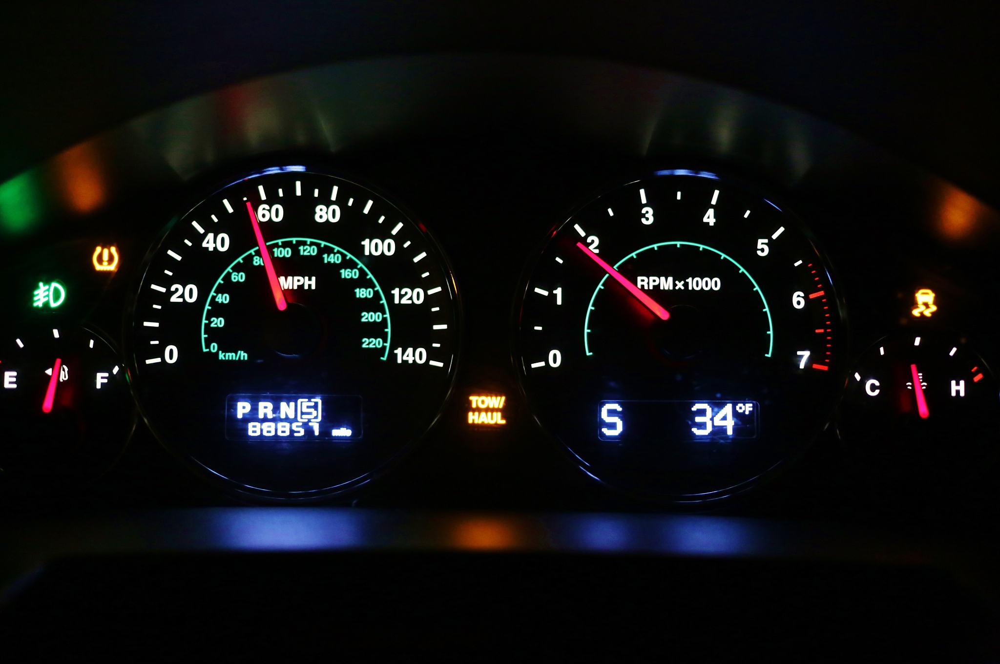 dashboard view of colorful gauges on a automobile