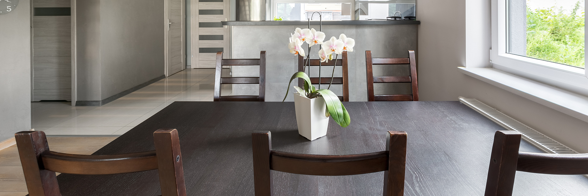 simple dining area open to kitchen